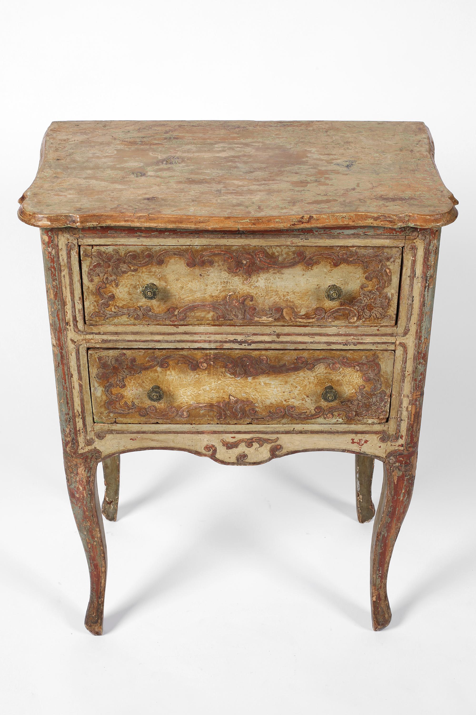 An elegant early 19th century Florentine side table/raised chest with the most fantastic muted and distressed original paintwork. Suitable as a generous bedside table, the two drawers with their original decorative bronze pulls. Italian, c. 1800.