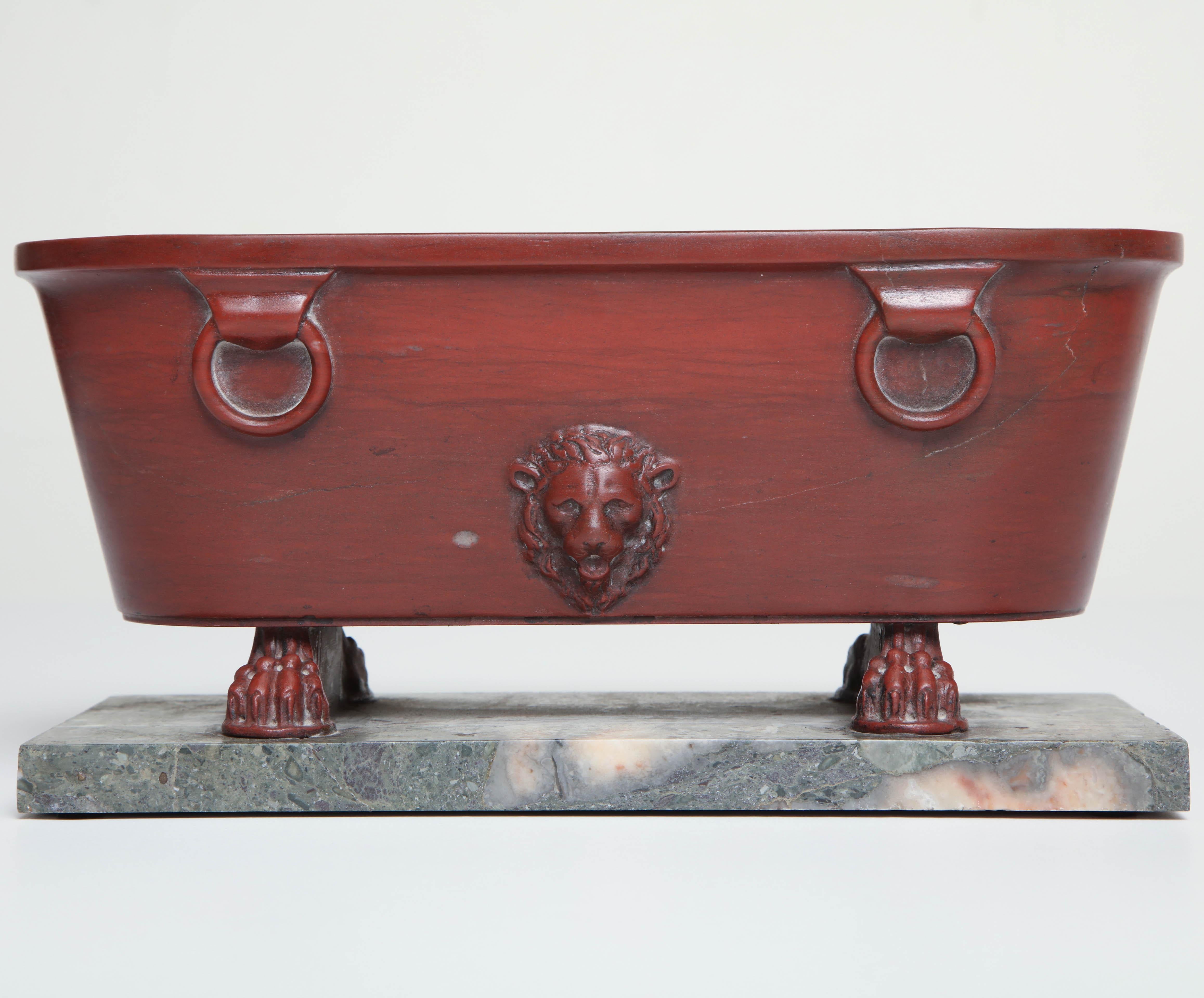 Early 19th century Italian, Grand Tour, Rosso Antico bath on an Africano marble base.
