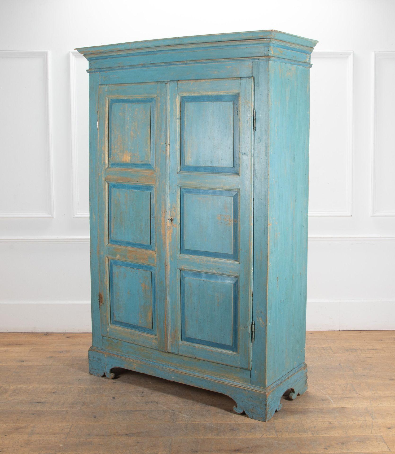 Early 19th Century Italian provincial armoire with deep panelled doors.
Original hinges, lock and key. Knocks down into base, cornice, sides, back panels, shelf and drawer.
A vibrant blue colour was discovered under a later layer of heavy brown