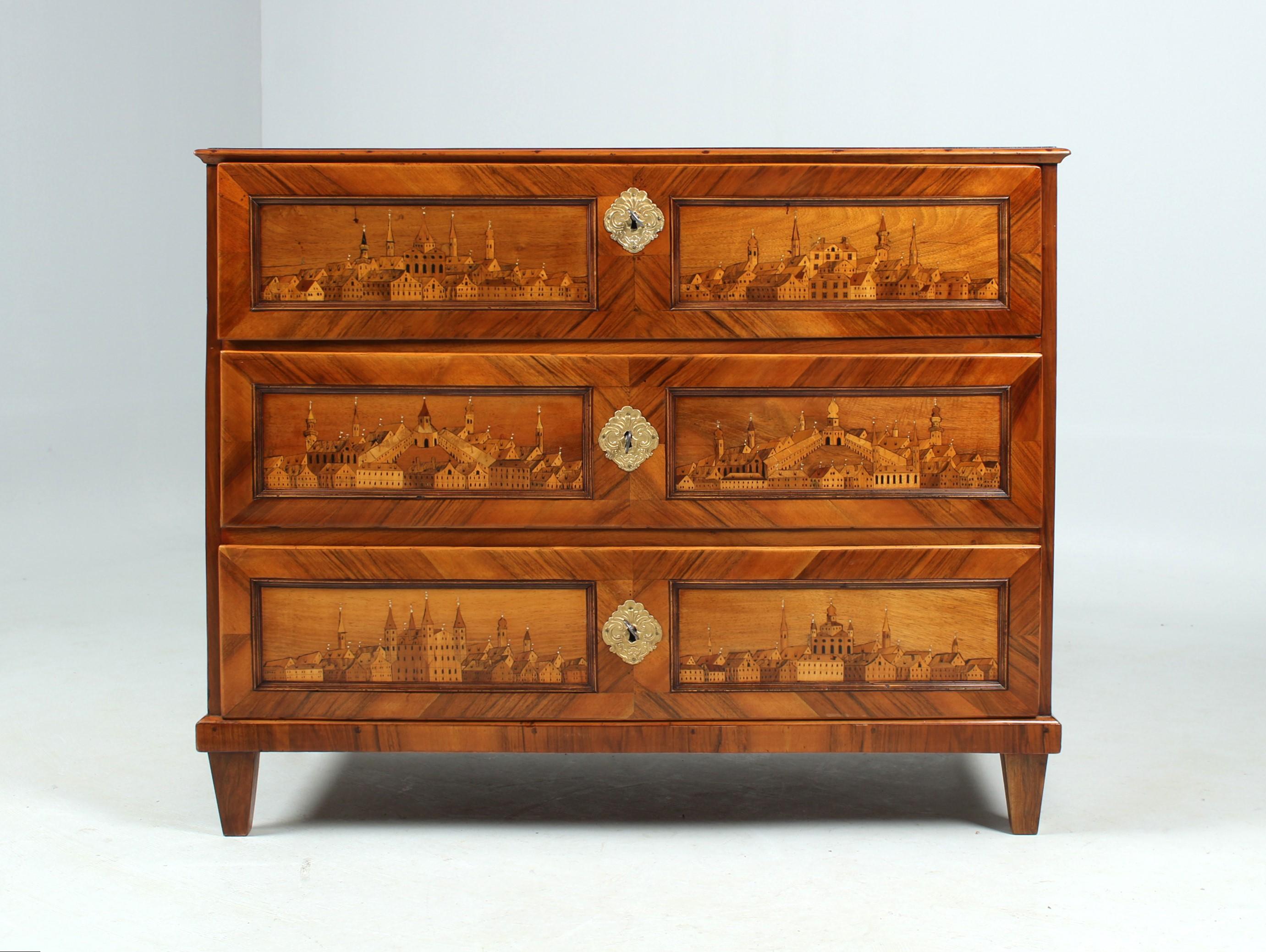 Antique chest of drawers with architectural marquetry

North Italy
Walnut, maple a.o.
Early 19th century.

Dimensions: H x W x D: 90 x 109 x 55 cm

Description:
Exceptional chest of drawers from Italian classicism, decorated all over with