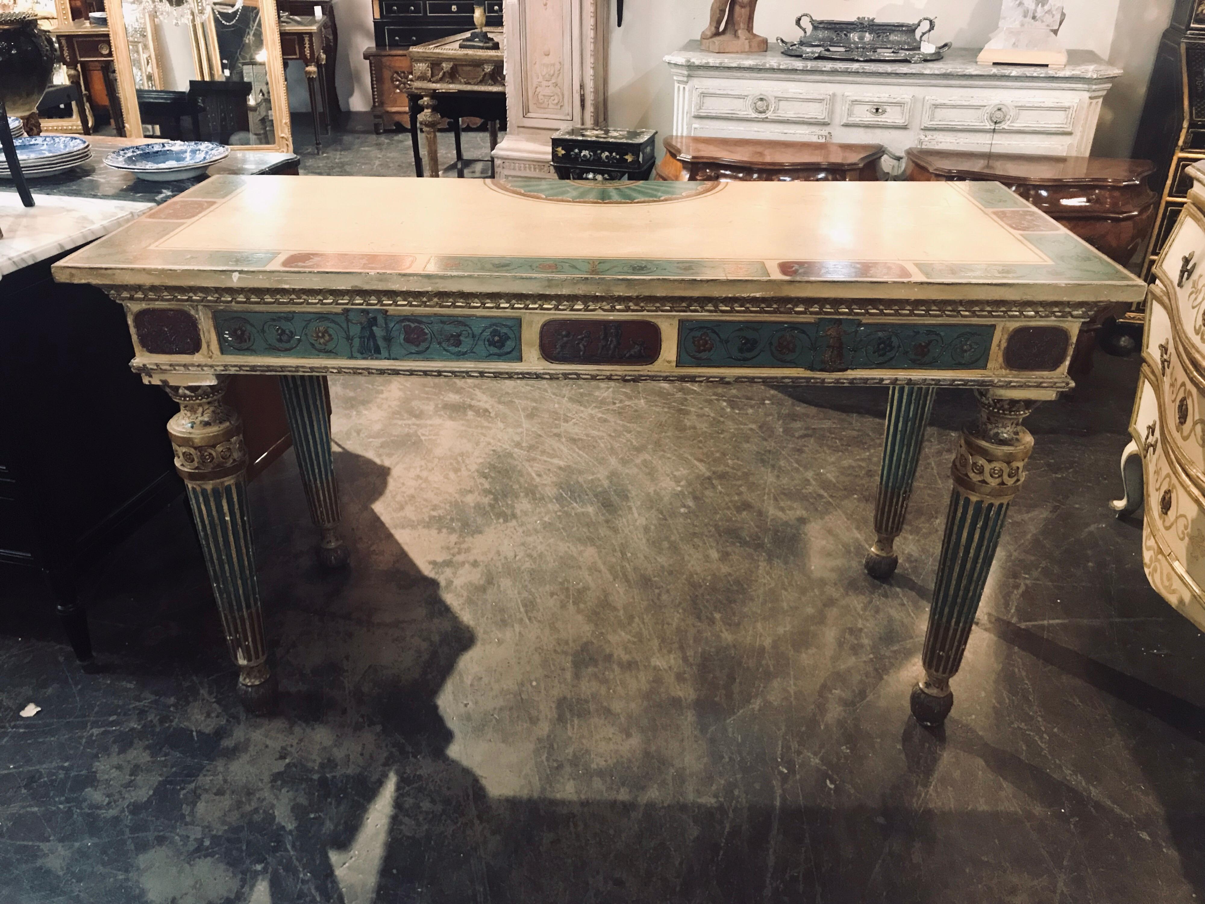 Fabulous 19th century, Italian neoclassical console, circa 1820. Having well executed hand painted detail of cherubs in pretty crème, blue and red colors. Nicely carved and fluted legs. Structurally very solid and only has very slight losses to