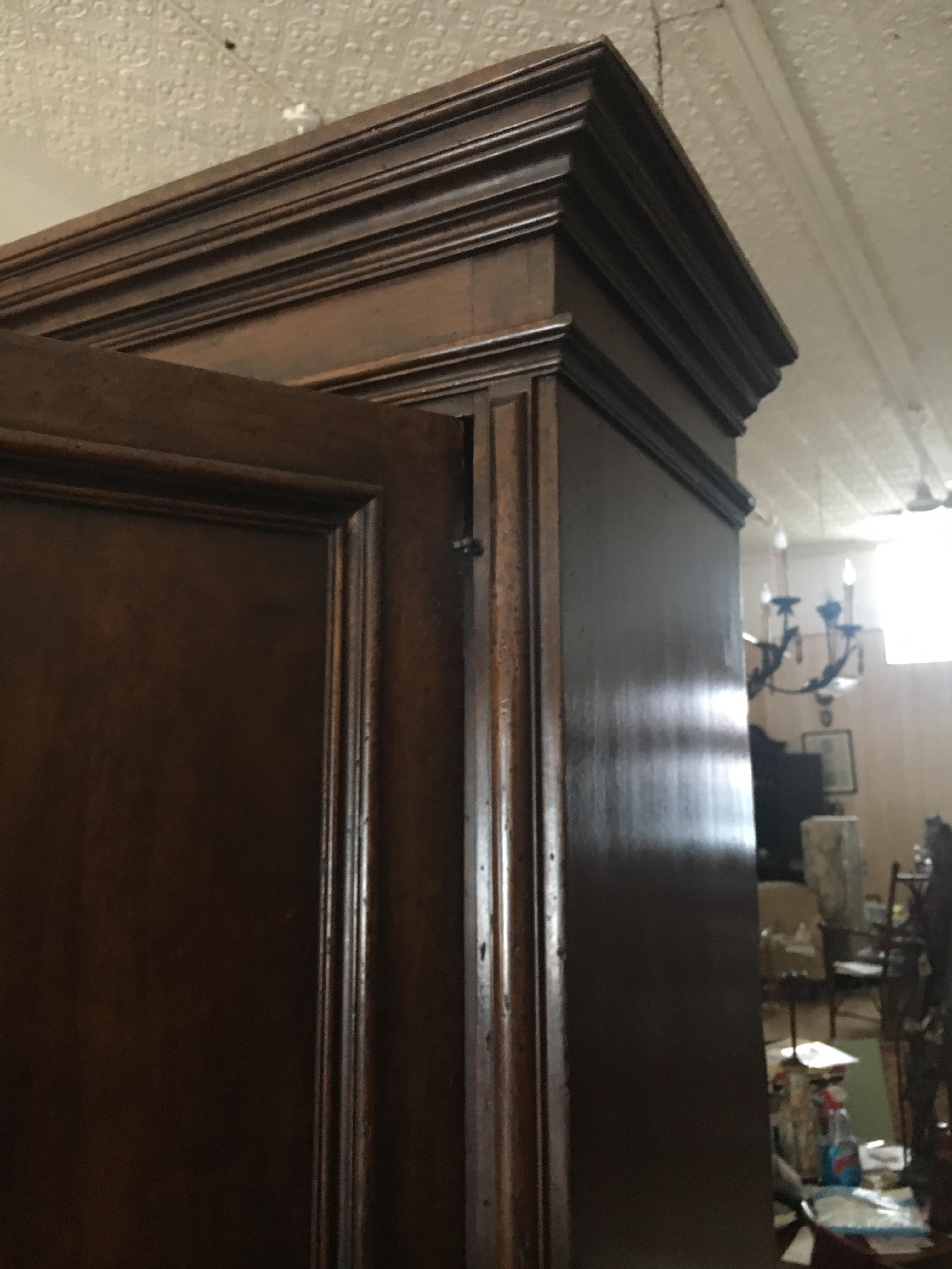 Very handsome early 19th Italian or Flemish cabinet, two doors over two drawers over two doors, walnut. Nicely detailed carving. Great storage, bar, anchor piece.
