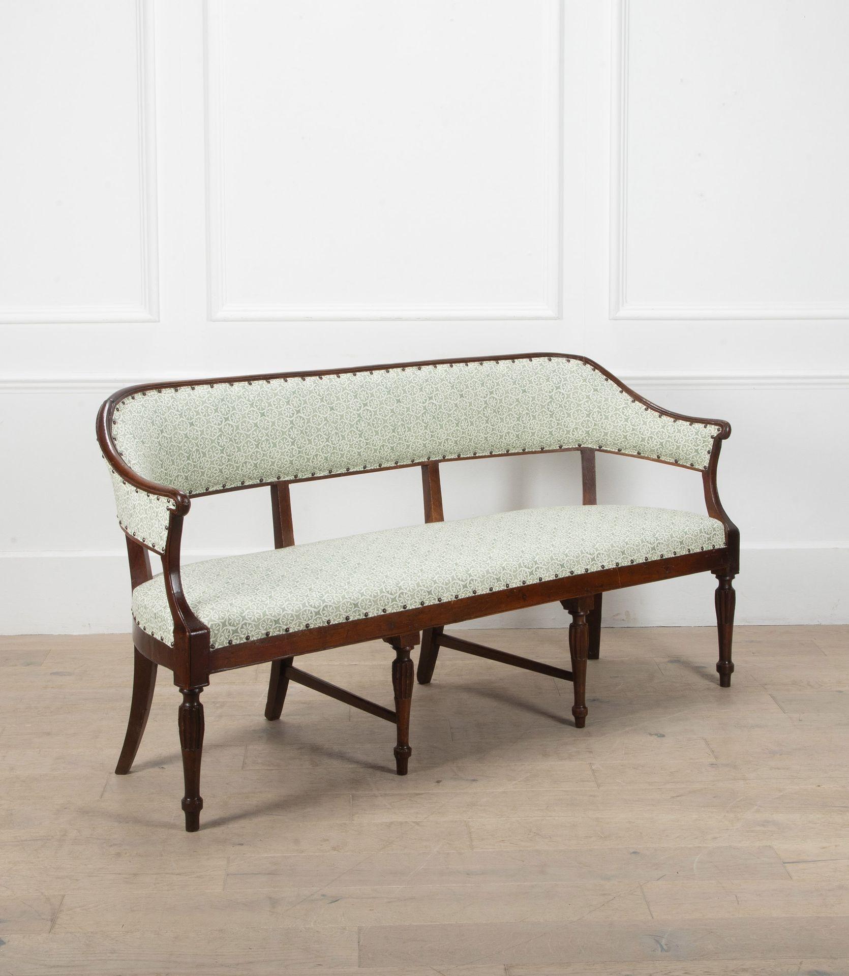 Early 19th century Italian walnut sofa.
With elegant curved upholstered back and recently reupholstered in Carolina Irvine Andaluz - Lichen.