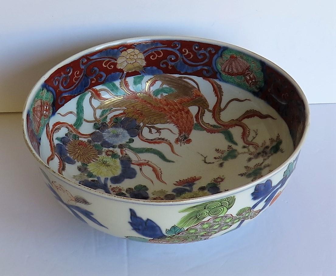 This is a good and very decorative porcelain footed bowl, finely hand painted and gilded, which we date to the early 19th century, Edo period or possibly earlier.

The bowl is circular and well hand hand potted on a fairly deep foot.

This bowl