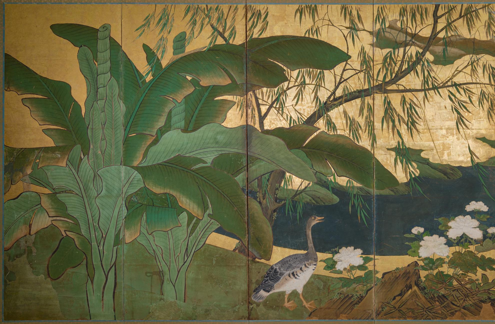 With a banana leaf palm on the left, at water's edge with geese. Perhaps a scene from the southern islands. Mineral pigments on mulberry paper with gold leaf and a silk brocade border.