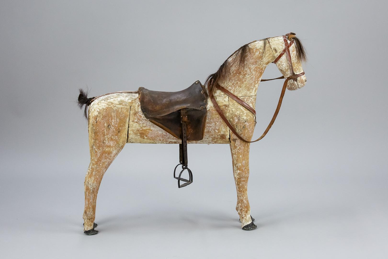 Wonderful large original 19th century horse, dry scraped back to its original finish. Found with his original leather tack, and leather applied hooves. A fine characterful example. Sweden, circa 1880.
   