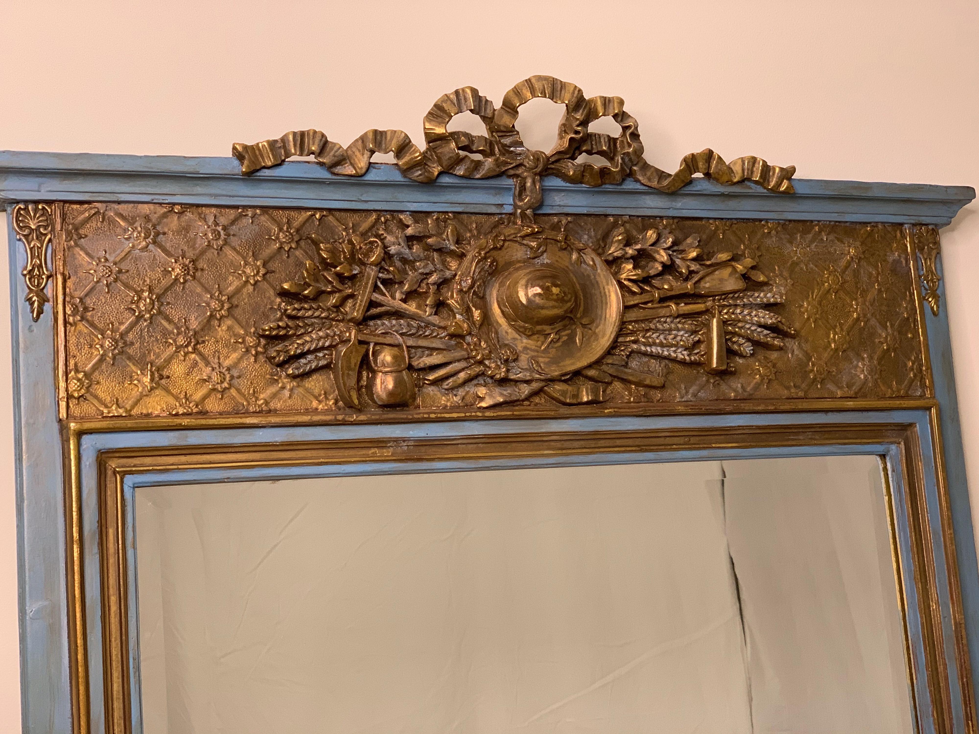 Early 19th century Louis XVI style painted and parcel-gilt mirror
Back template has been replaced, blue paint is an addition at a later date. The structure of the mirror is original.
Dimensions: 33.5