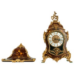 Horloge murale de style Louis XV du dbut du XIXe sicle monte sur bronze