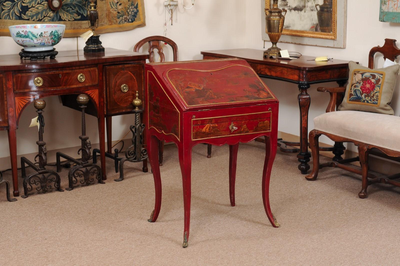 Louis XV style red Lacquered slant front bureau / desk with lower drawer & fitted interior, Chinoiserie decoration, Cabriole legs, and mounts on feet, 19th century, France.