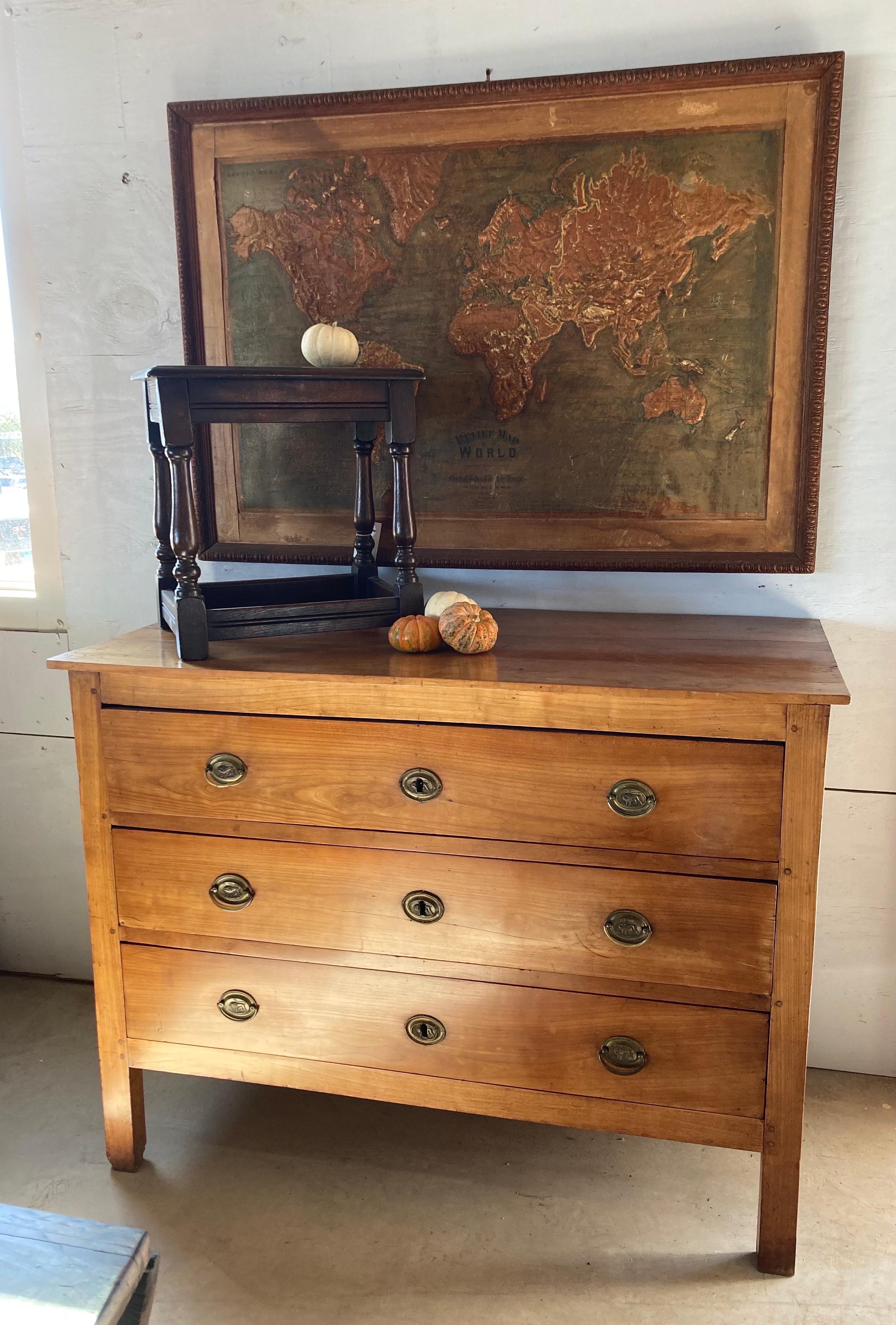 Louis XVI French cherry commode hand-made using pegged construction in the early 1800s. This is an absolutely gorgeous chest with character, finish and proportions. The chest features large drawers inset in the frame, which still sits on its