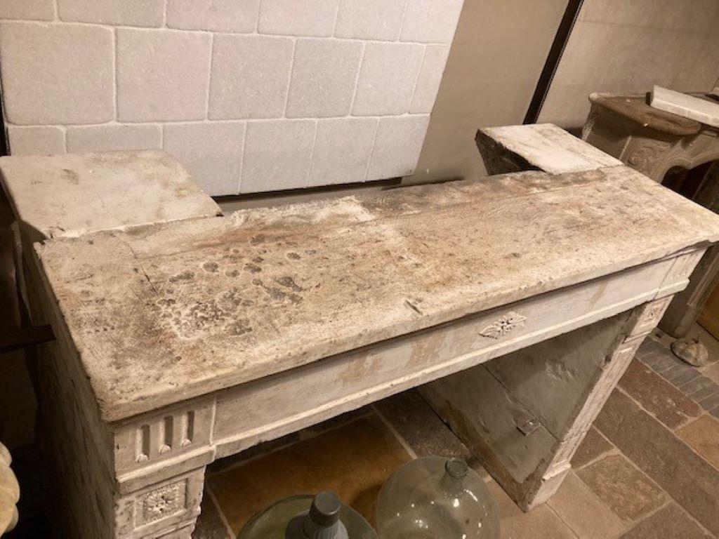 Carved Early 19th Century Louis XVI Limestone Fireplace Mantel For Sale