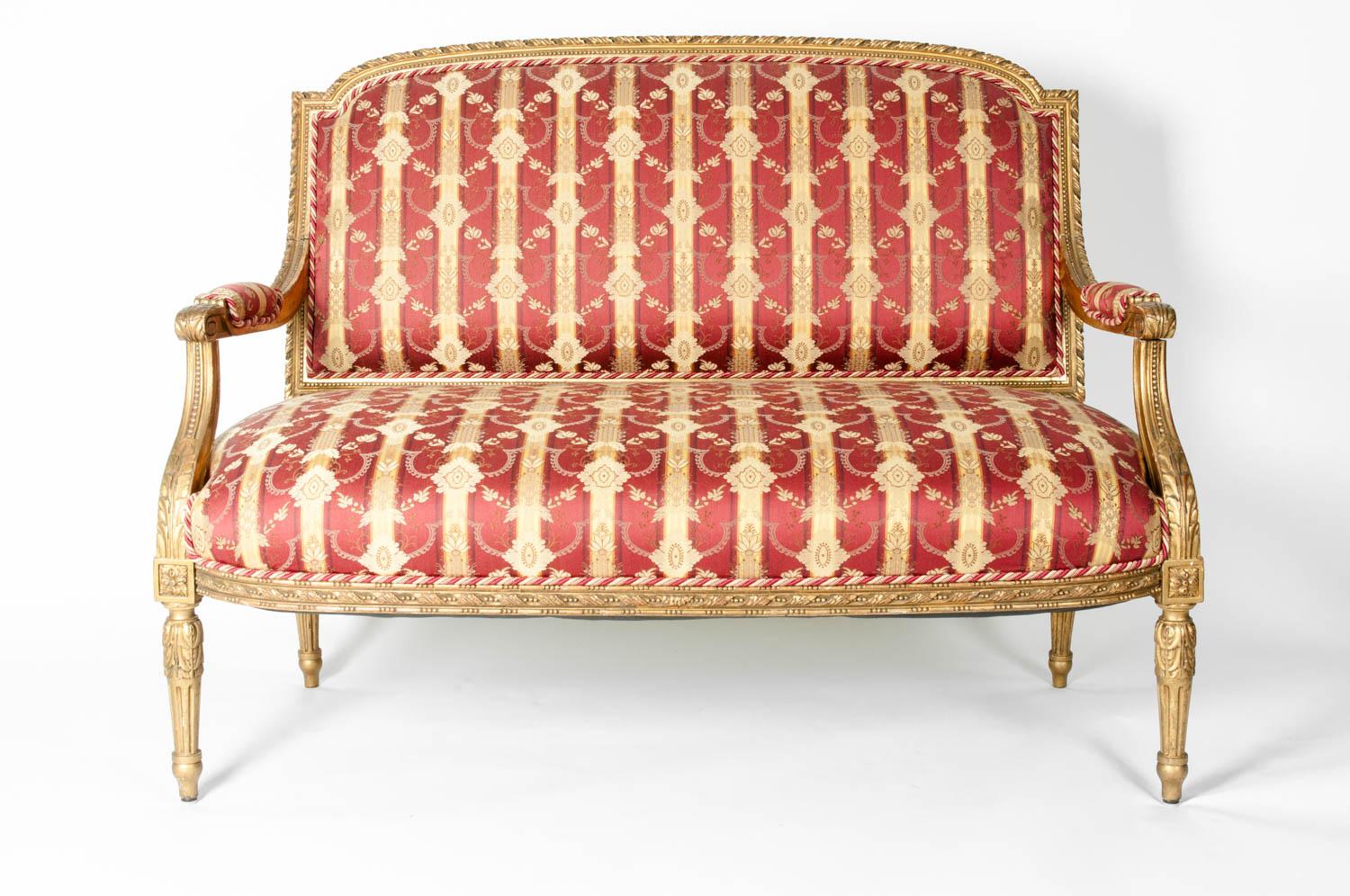 Early 19th century Louis XVI style giltwood framed with silk Damask upholstery settee. The settee is in excellent antique condition, the upholstery is very immaculate. The settee measure 37 inches high x 48 inches width x 25 inches deep. The seat