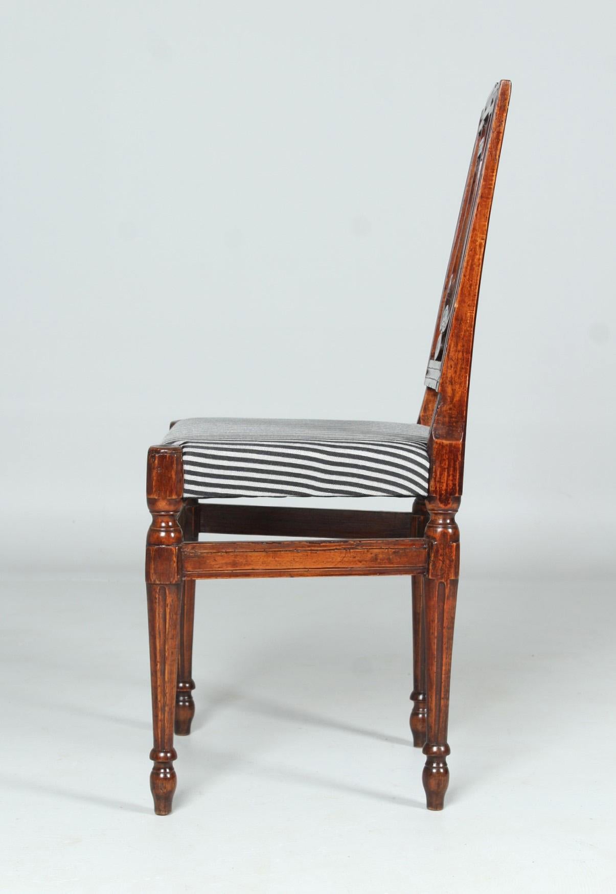 Beautiful antique chair with lyre motif in the back board. The chair is made of solid walnut and walnut stained beech.
On the back there is a signature: J. Pausch.

Signs of age and use. Completely restored and shellac polished. Newly