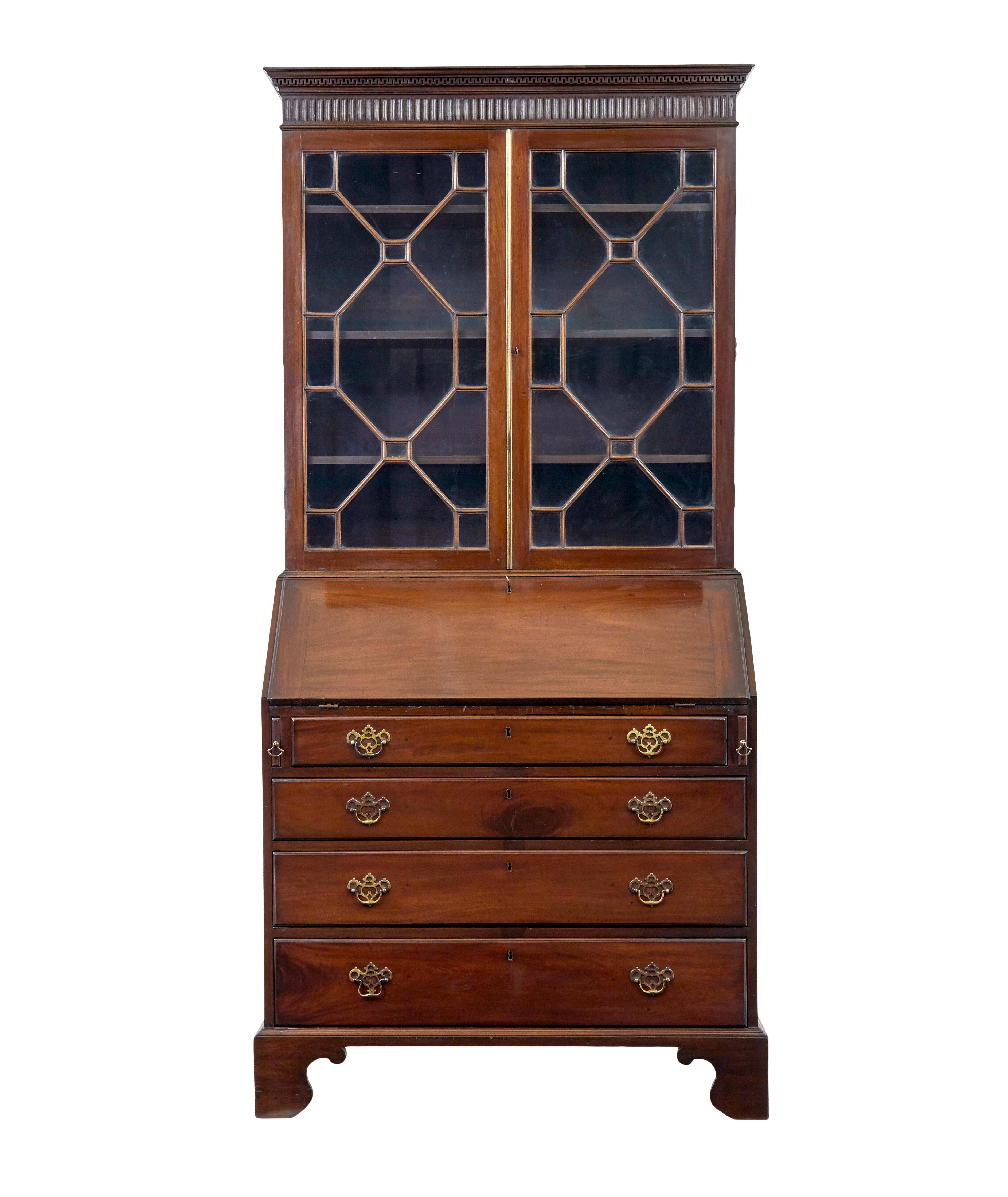 Early 19th century mahogany bureau bookcase circa 1810.

Good quality late Georgian astral glazed 2 part bureau bookcase.

Top bookcase section with a carved dentil freize cornice, below which the astral glazed double doors open to reveal 3
