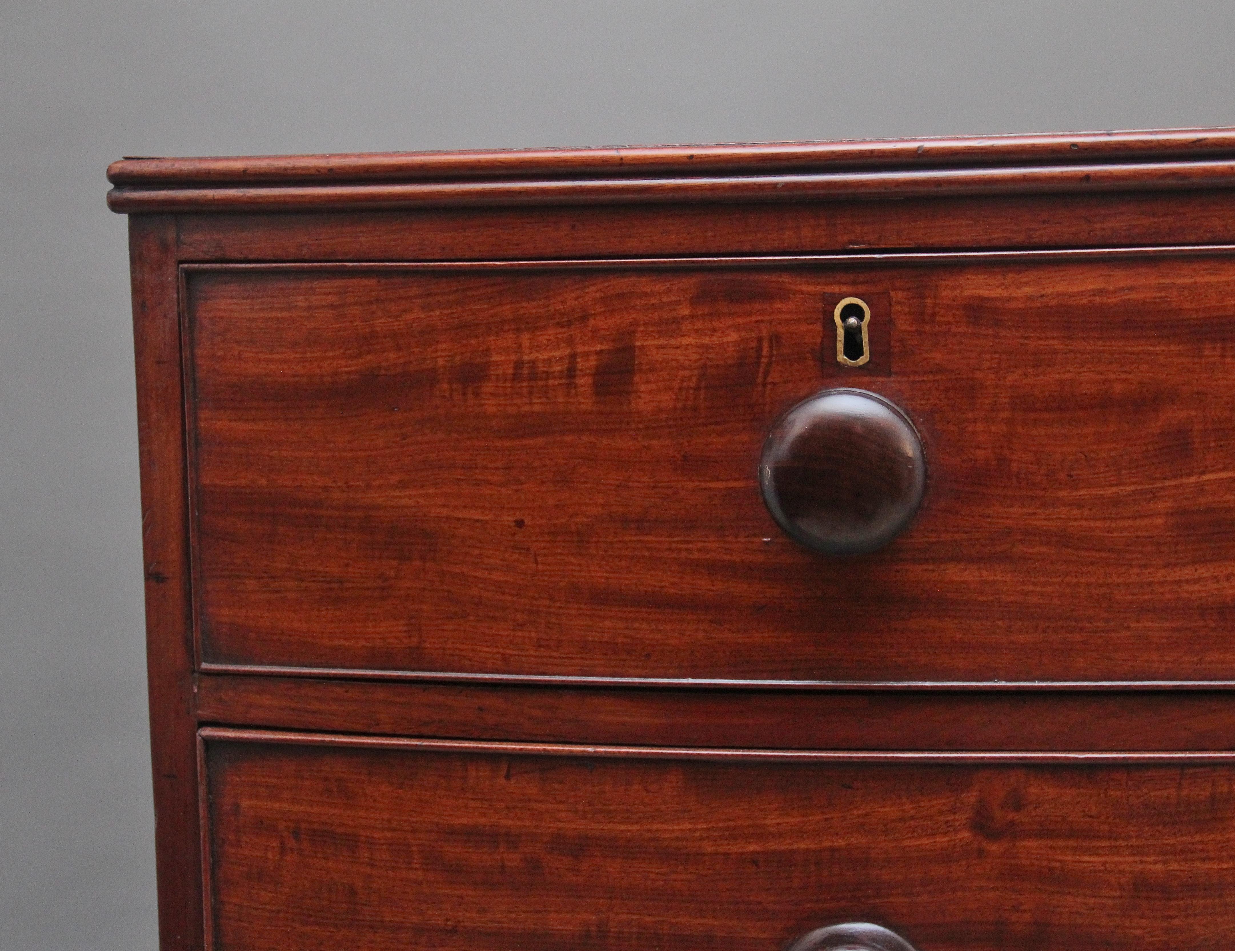 Early 19th Century mahogany bowfront chest of drawers of nice proportions, having a nice figured top with a moulded edge above a selection of two short over three long oak lined drawers with the original turned wooden knob handles, having a nice