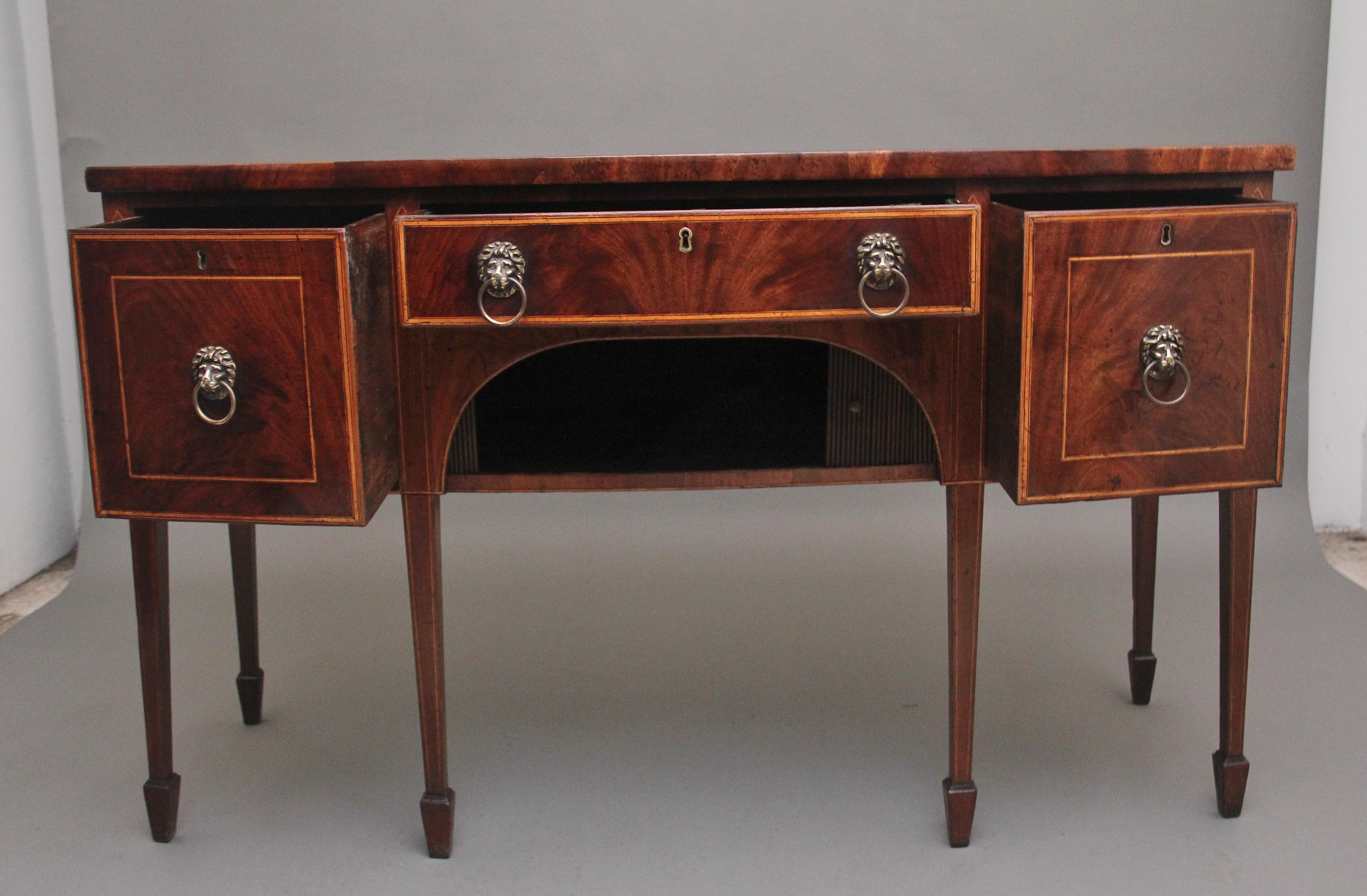 A superb quality early 19th Century mahogany inlaid bowfront sideboard, having a lovely figured top above a central drawer and two deep drawers either side, all drawers are oak lined and have the original lion mask handles, inlaid drawers fronts,