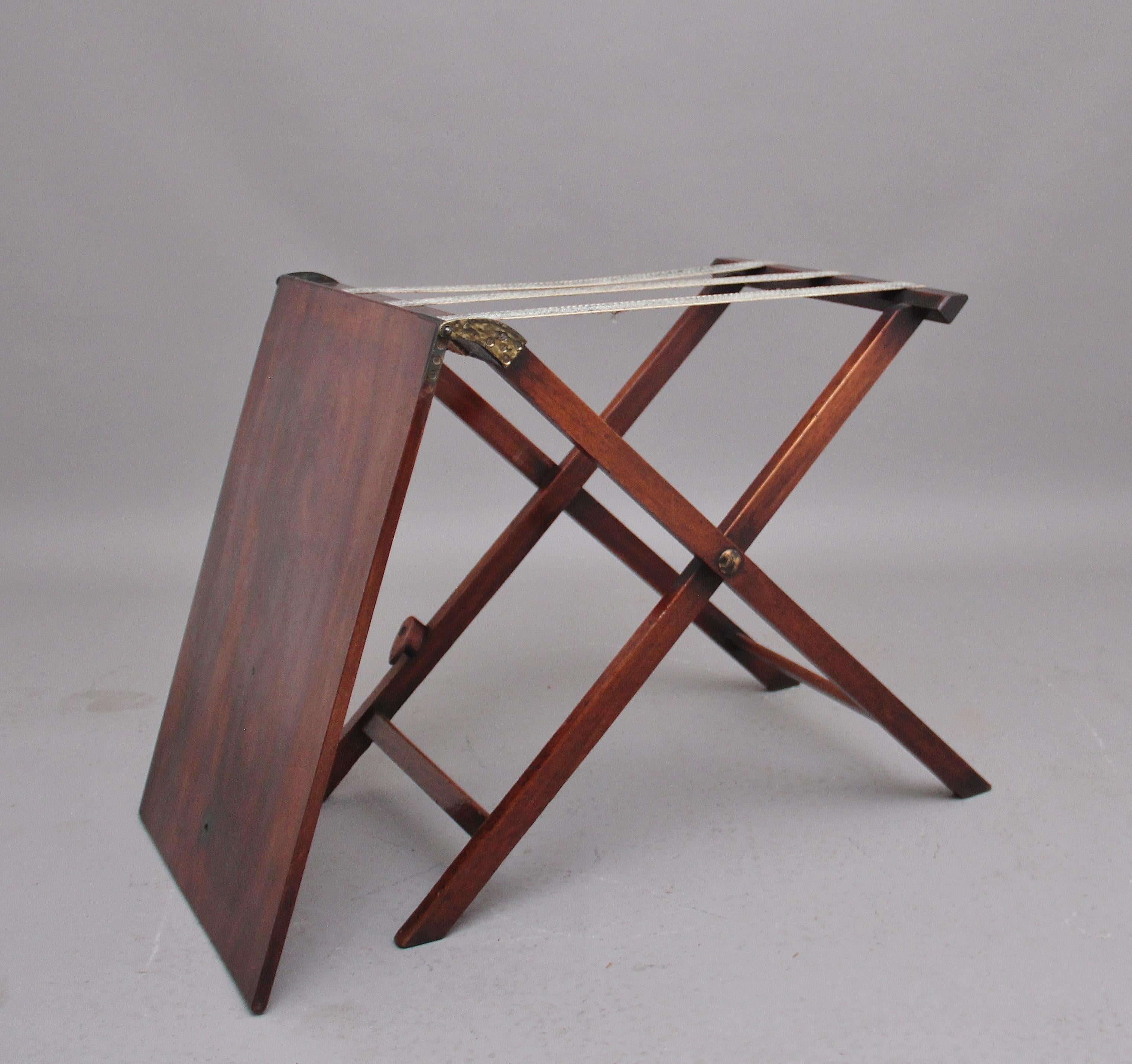 An unusual and rare early 19th century mahogany collapsible butlers tray on stand, hinged rectangular top on X frame stand collapsing flat with locking device. Circa 1810.