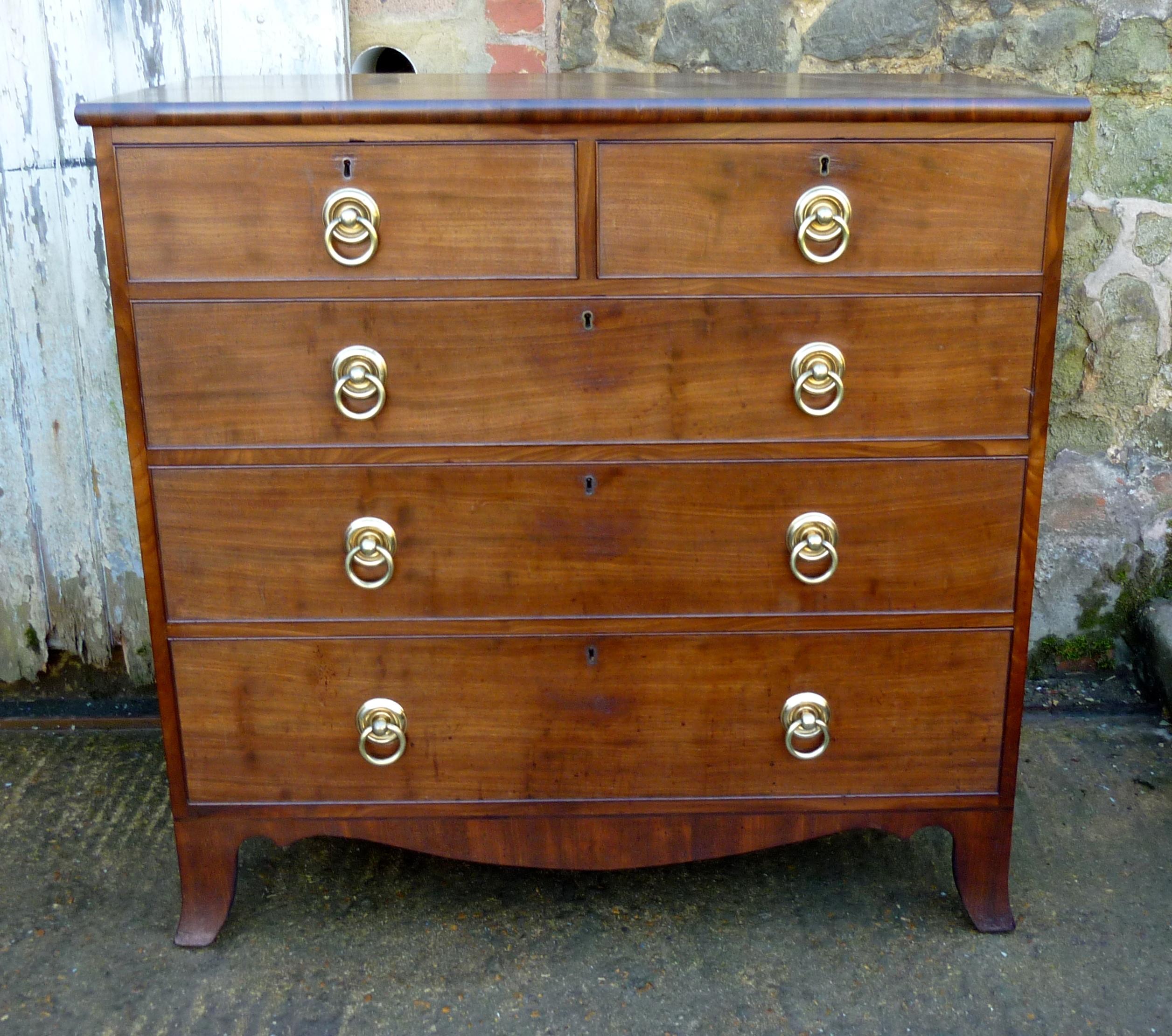 Early 19th century mahogany chest of drawers

This superb piece of furniture dates from circa 1820, it is was a greatly favoured piece because of the great amount of storage it gives
The chest stands on splayed bracket shaped feet, it has two short