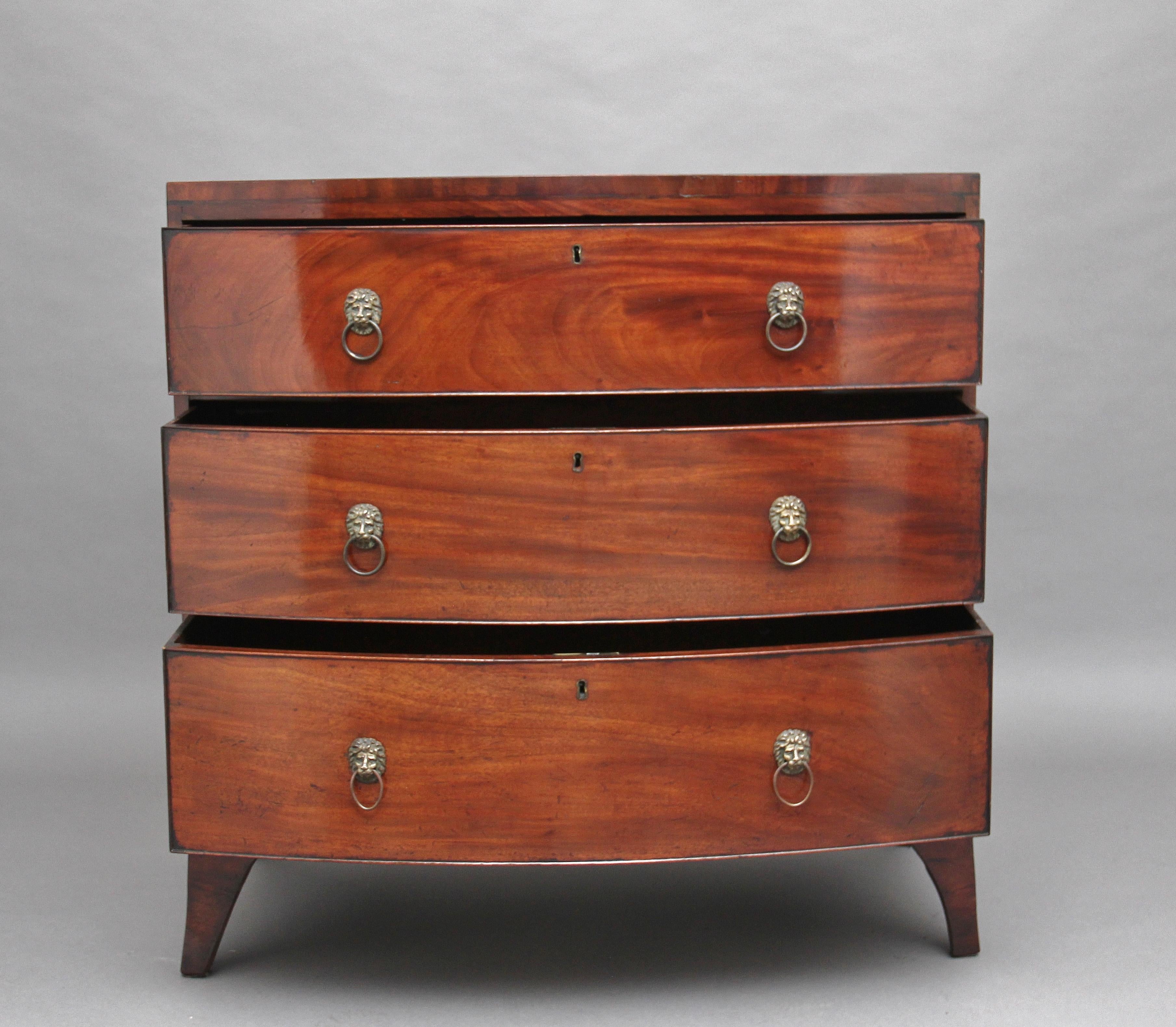 Early 19th century mahogany bowfront chest of drawers of good proportions, the bowfronted top above three oak lined, graduated drawers with original brass lion head / ring pull handles, supported on elegant splay feet, circa 1820.