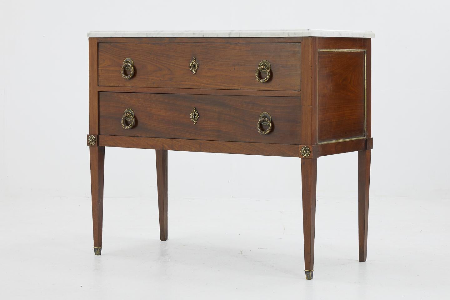 Petite early 19th century two-drawer French mahogany commode.

