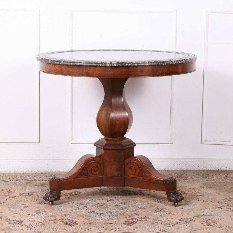 Louis Philippe mahogany gueridon / center table. The marble top is white & grey with a triple beveled edge. Standing on a flamed mahogany pedes, with curved carved legs and claw feet. C.1820

Dimensions:
Diameter: 32″ 
Tall: 28.5″
