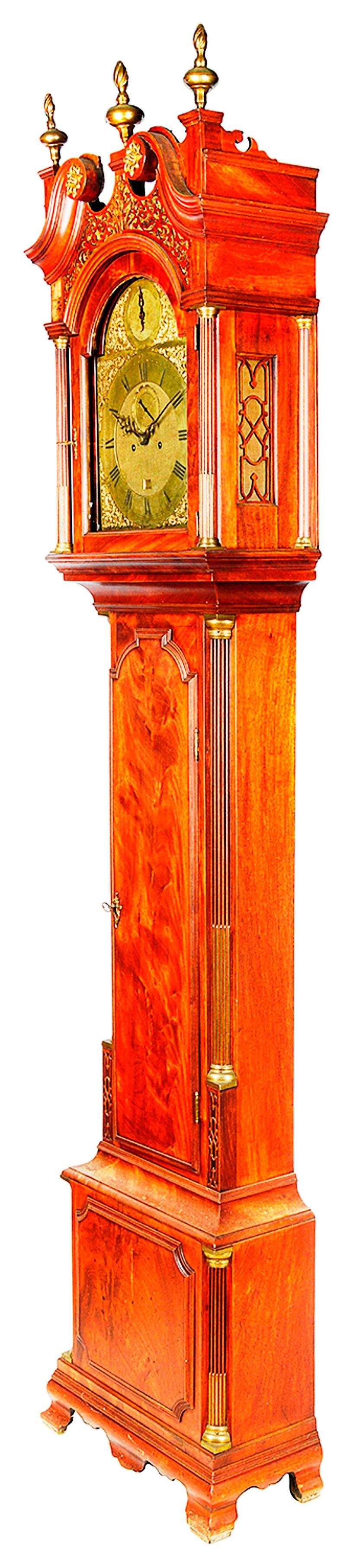 A very good quality late 18th century London longcase clock by 'Chater and Sons, London'. Having a swan neck pediment, three brass flame finials, blind fretwork, a brass faced arch dial, an eight day movement, chiming on the hour. The flamed