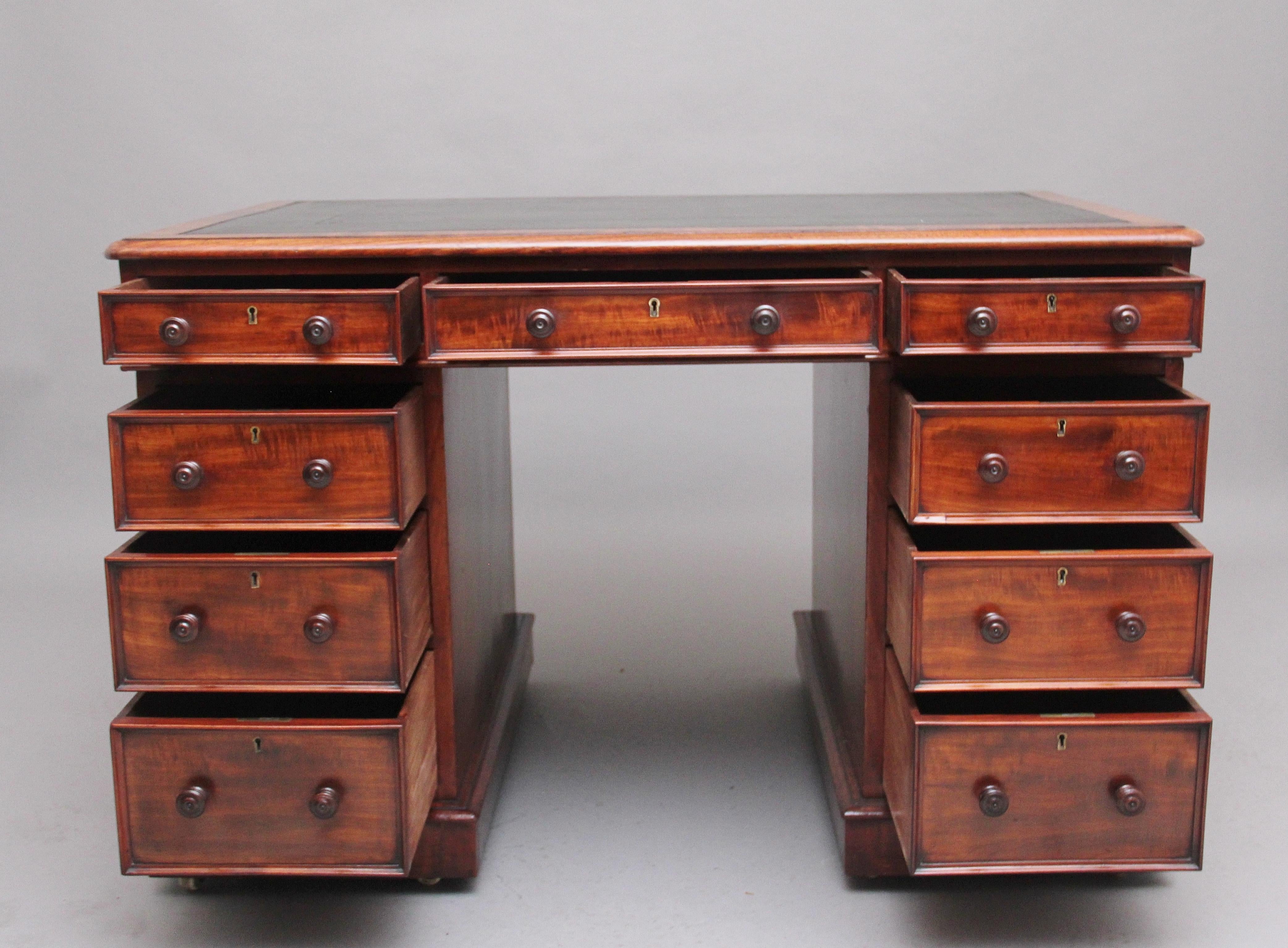 A superb quality early 19th century mahogany pedestal desk, the moulded edge top having a green leather writing surface decorated with gold and blind tooling, the desk has an arrangement of nine graduated mahogany lined drawers with the original