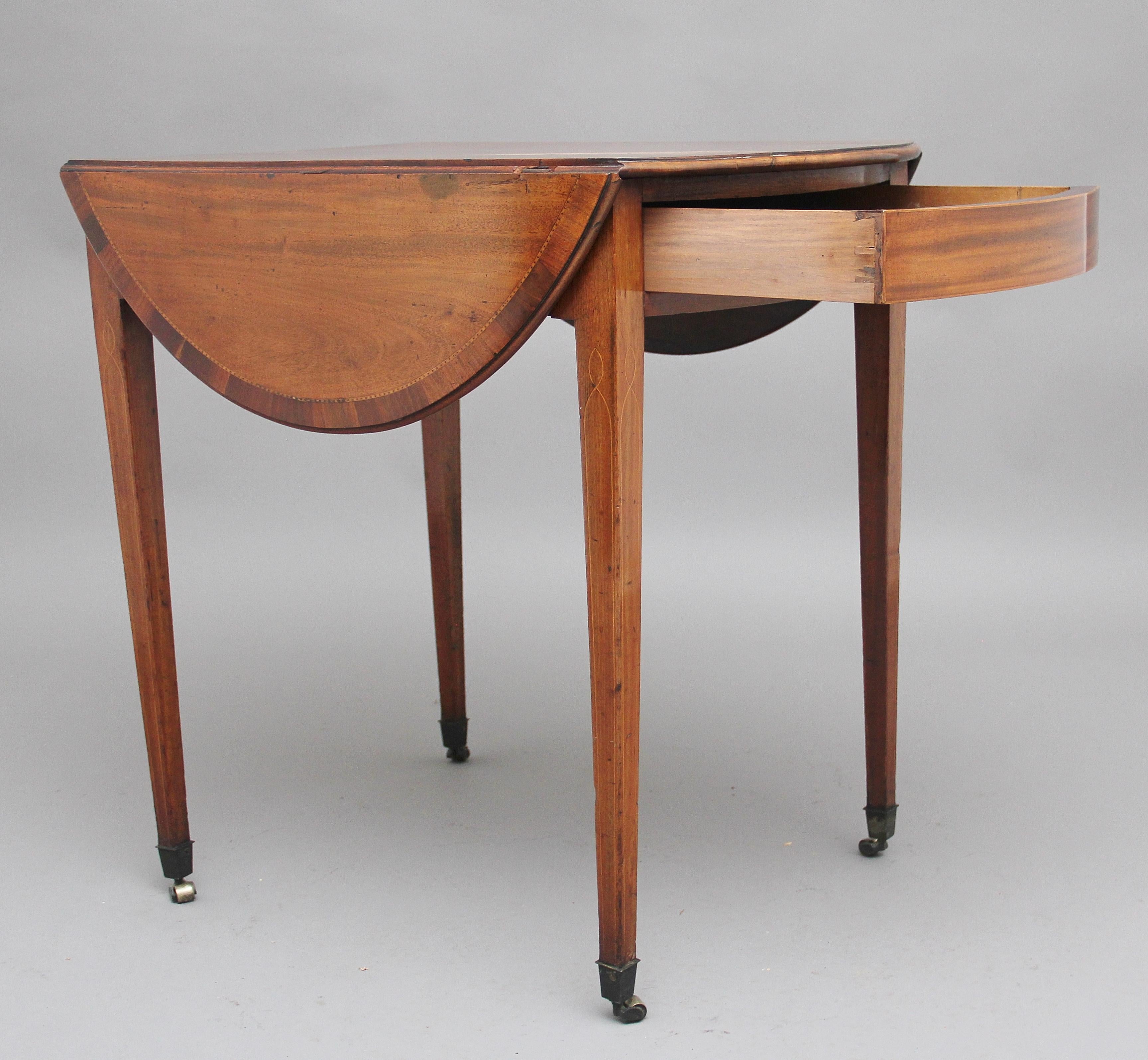 Early 19th century mahogany Pembroke table, the moulded edge oval top crossbanded and decorated with chequered inlay, with the top also having a nice figuration and lovely color, having a single drawer at one end, supported on square tapering legs