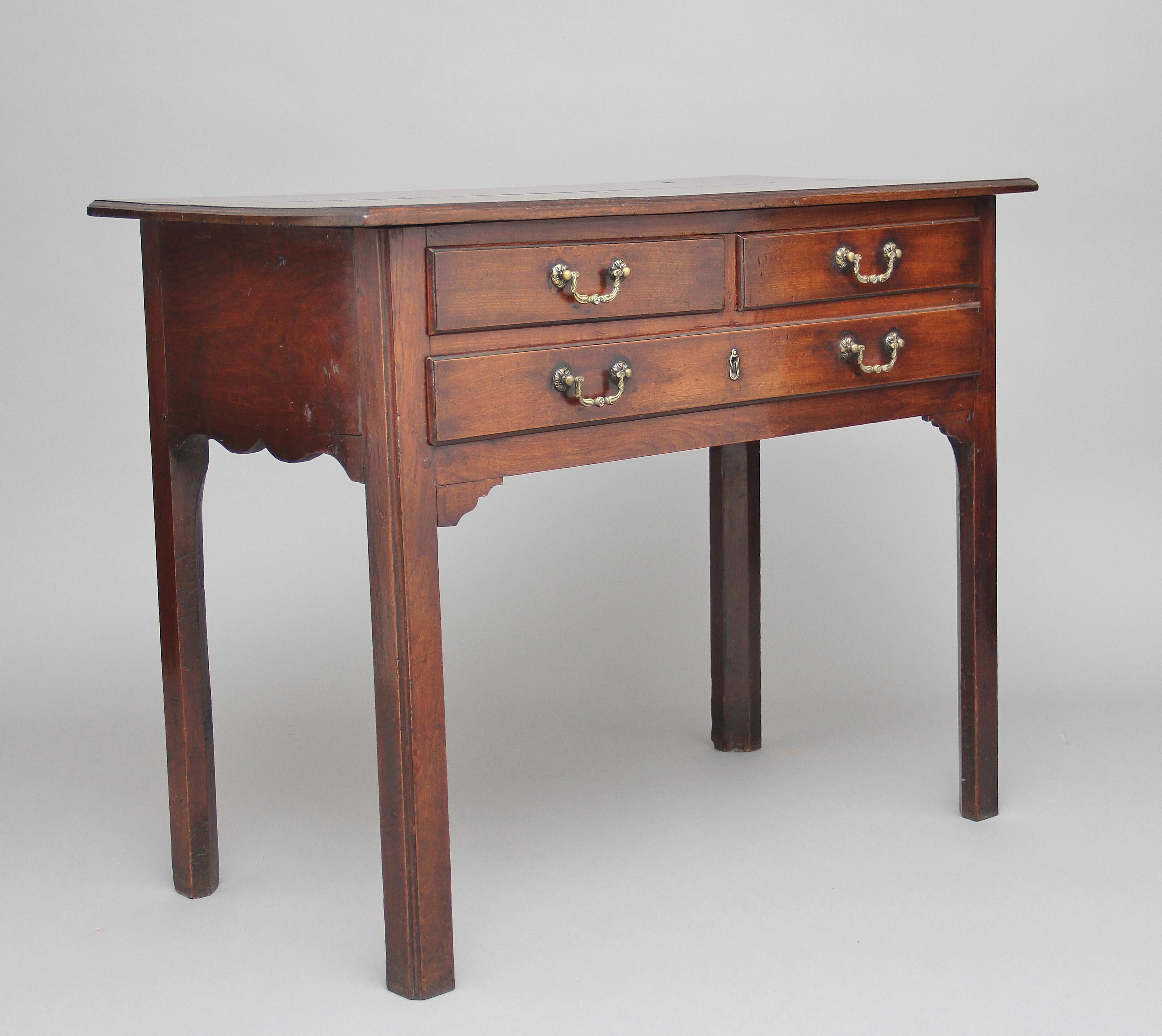 Early 19th century mahogany side table having a nice moulded edge top above two short over one long drawer with original decorative brass swan neck handles, shaped apron to the sides and front, standing on four chamfered legs, circa 1820.
    
