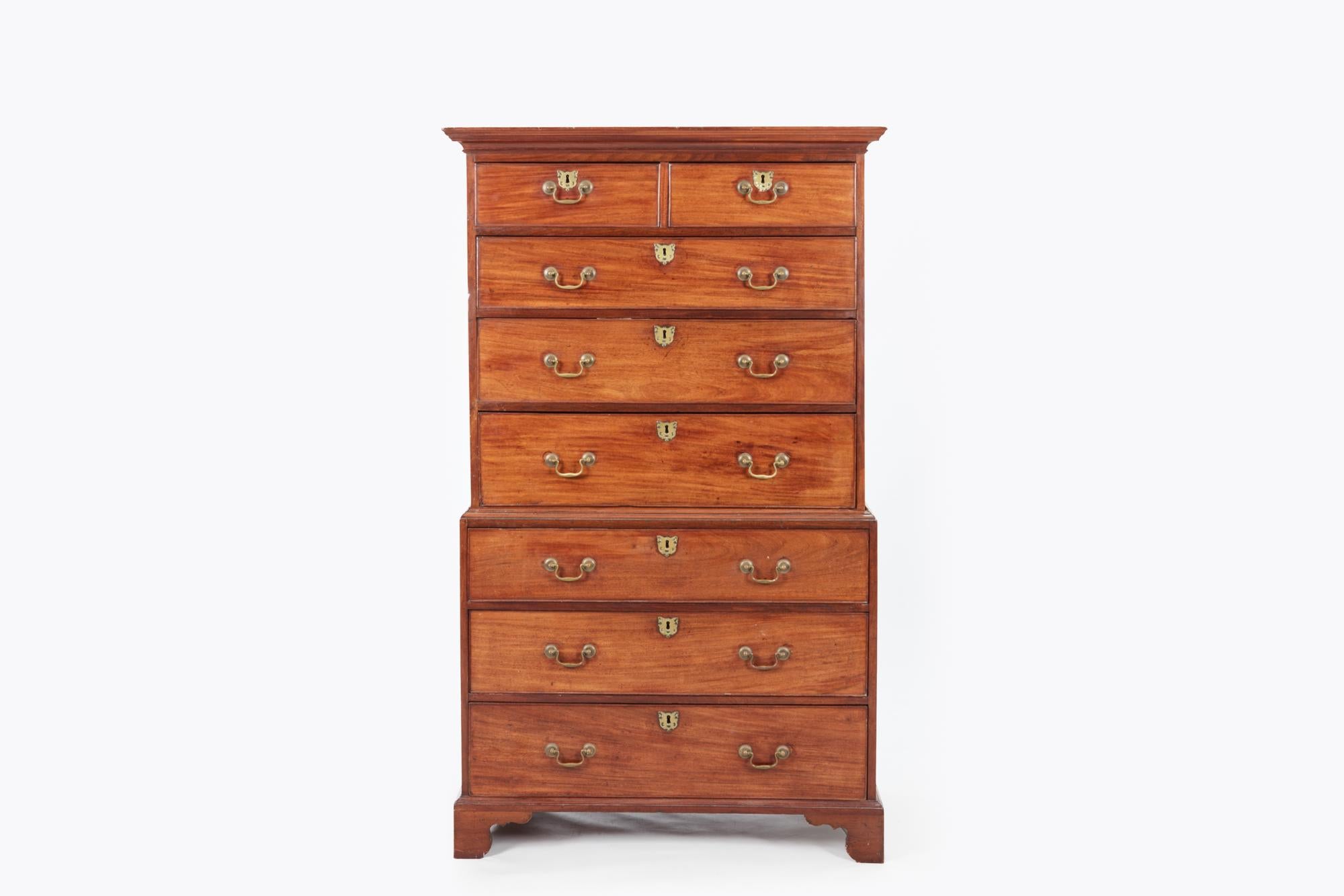 Early 19th century mahogany chest on chest or tallboy, the moulded edge top above a selection of eight drawers, two short over six long graduated drawers, with brass pulls and escutcheons terminating on ogee bracket feet.