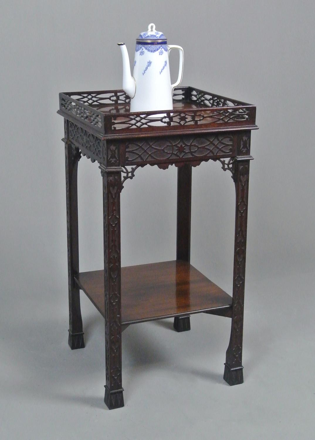 A wonderful early 19th century mahogany tea kettle stand with beautiful blind fretwork carved legs and a pierced fine fretwork gallery and spandrels in the Chinese Chippendale manner.

With a beautiful and rich colour and with a single board of