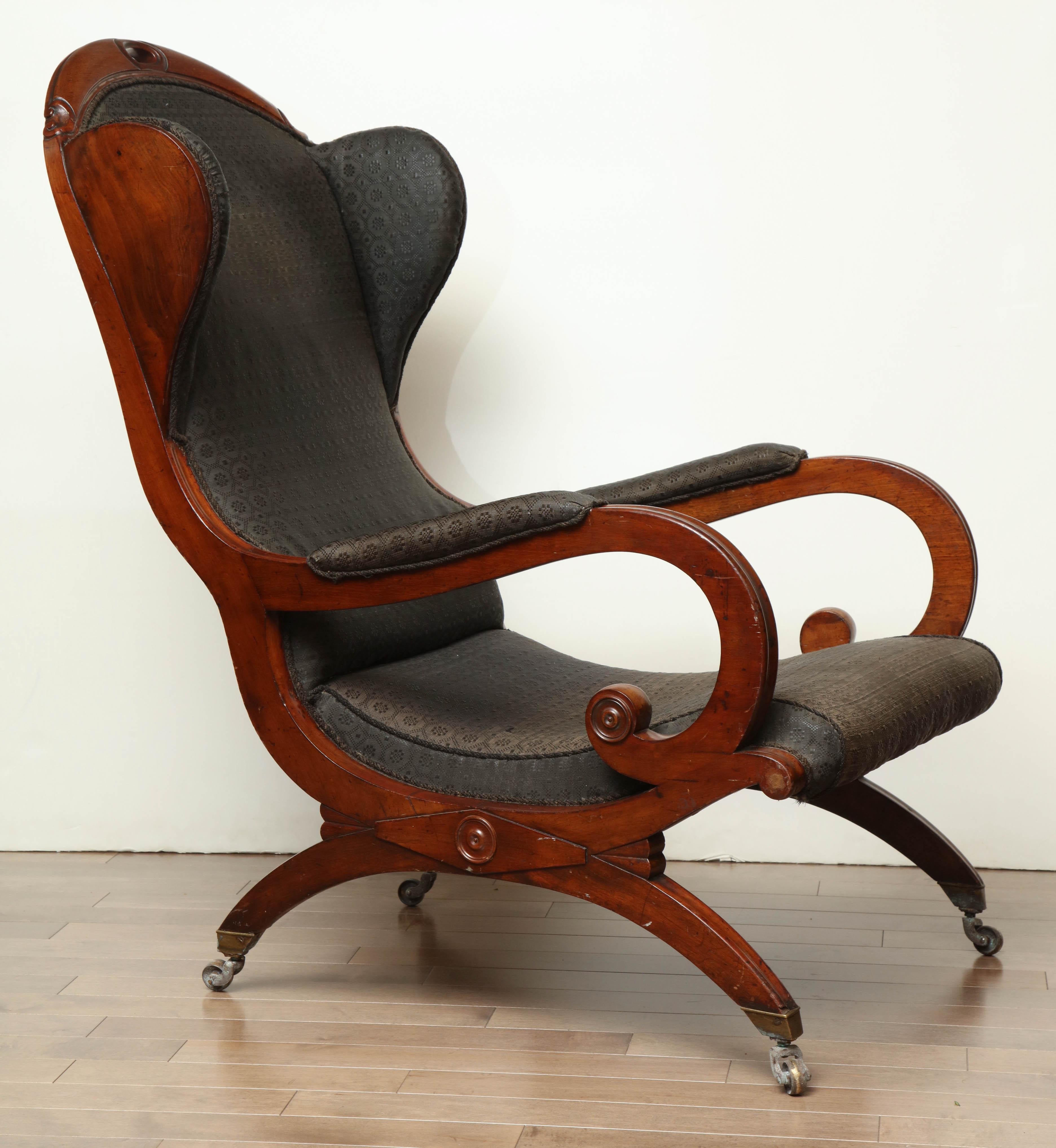 Early 19th century mahogany wing chair.