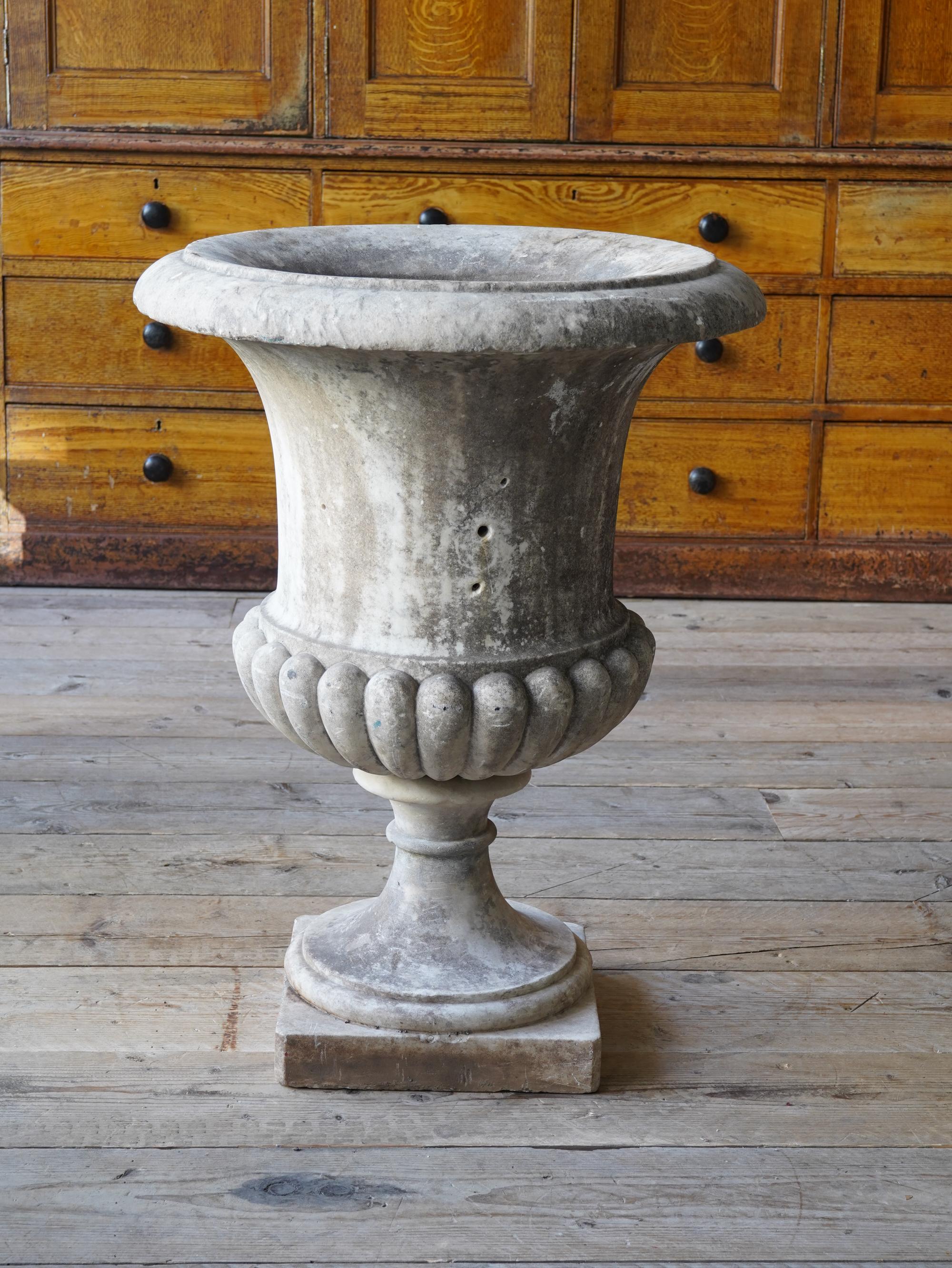 The lightly grained marble campana form urn of good scale and particularly well carved.

English, circa 1820. 

Measures: H:84 W:62 D: 62 CM

H:33 W:24.4 D:24.4 inches.
   
