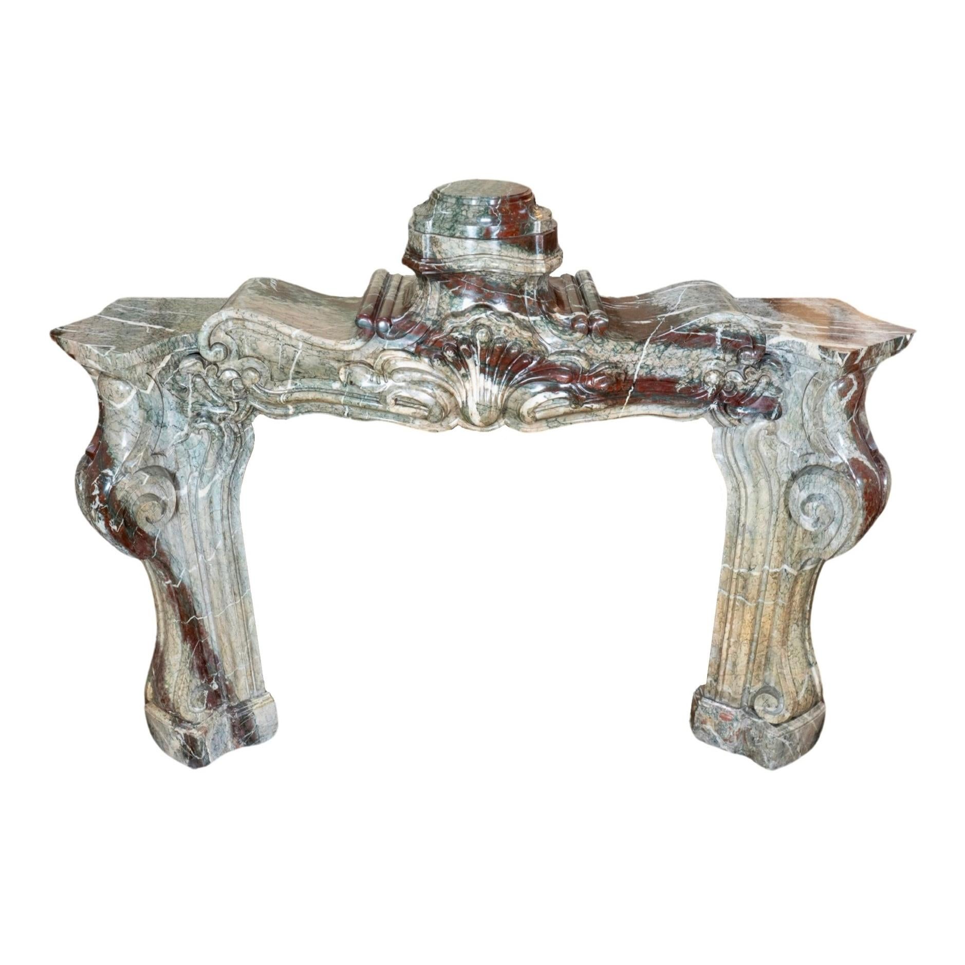 Baroque marble fireplace. Originates from France, circa 1800. This unique mantelpiece is the perfect way to add style and elegance to your home, with its intricate design featuring ornate detailing and luxurious Baroque marble.

 

Measurements: