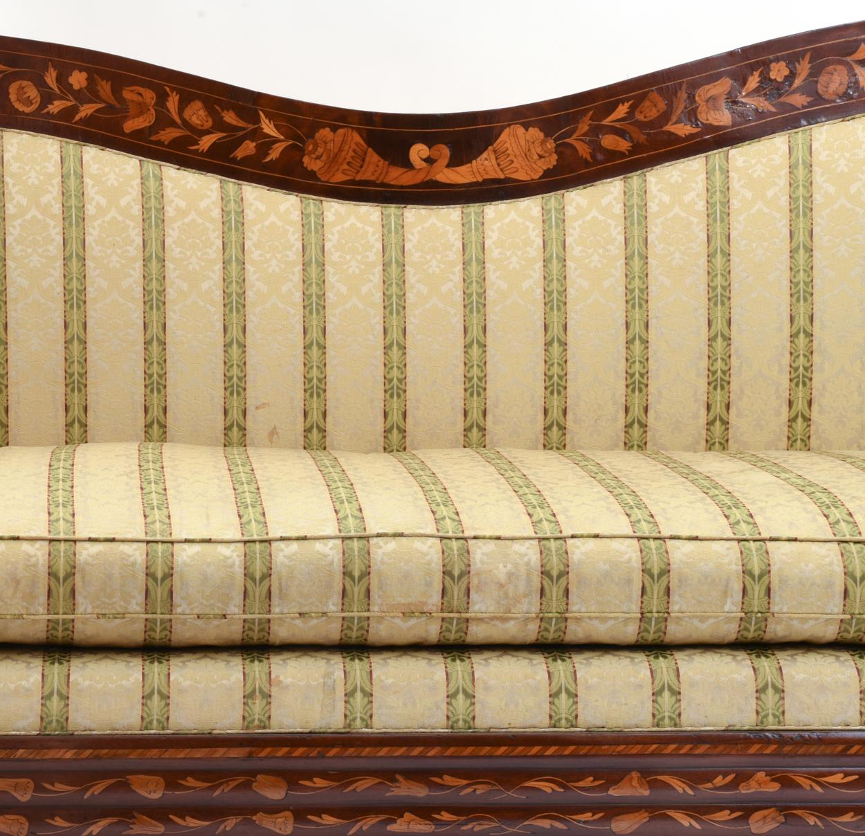 Early 19th century well proportioned marquetry wood inlaid sofa with scrolled back and rolled arms design details with short Grecian curved legs with claw and ball feet. The sofa is in excellent antique condition. Minor wear consistent with age /