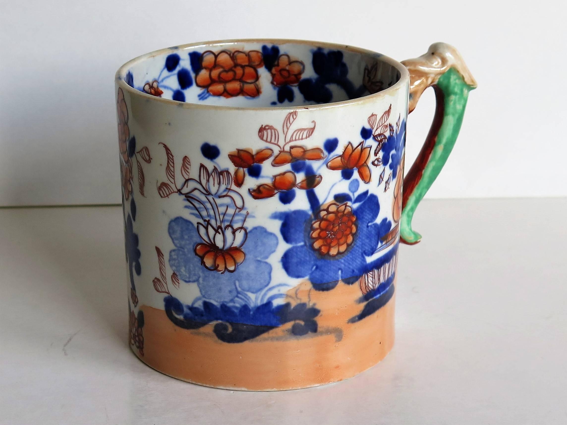 This is a good pottery mug made by the English factory of Mason's Ironstone, fully marked and dating to the early 19th century, circa 1825.

Early Mason's mugs tend to be fairly rare and hard to find.

The mug is cylindrical with a slight taper