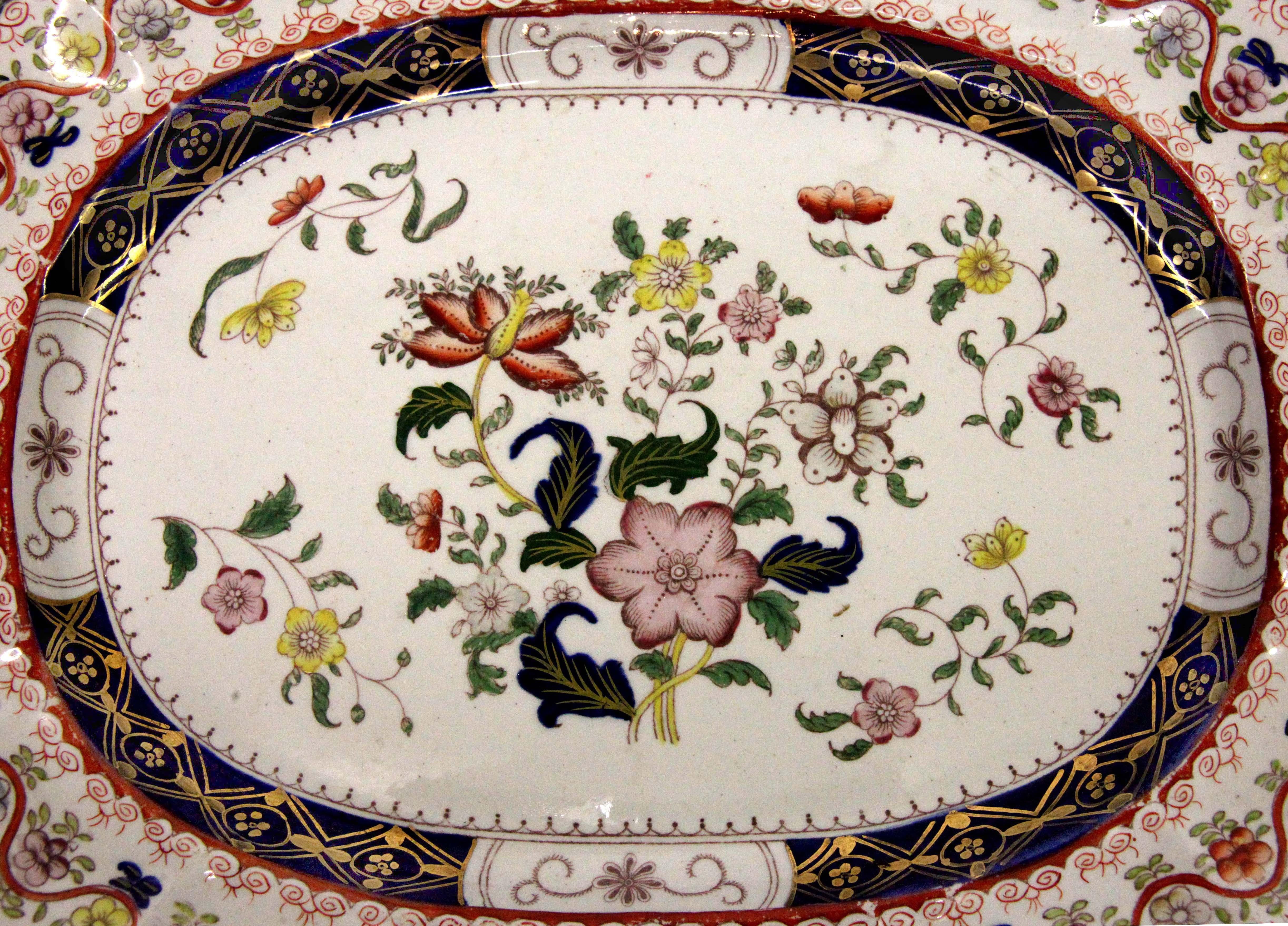 Early 19th century Mason's Ironstone platter, the polychrome floral border separated by serpentine line, the interior with leaf and floral design accentuated by gilding over cobalt. This mark is shown in Geoffrey Godden's Encyclopedia of British
