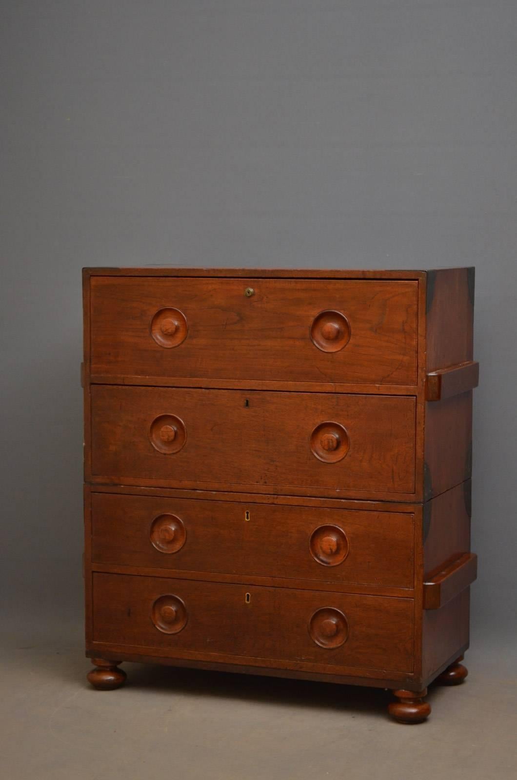 Sn4304 early 19th century teak secretaire Campaign chest of drawers, having metal bounds and four graduated drawers, one being a secretaire, all fitted with original turned and recessed handles and carrying handles to sides, standing on turned feet.