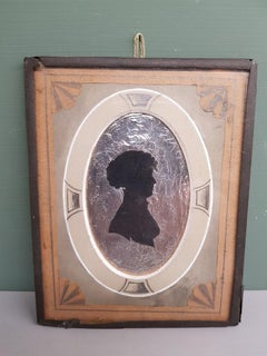 Early 19th Century Miniature Silhouette of a Lady on a Silver Paper Background