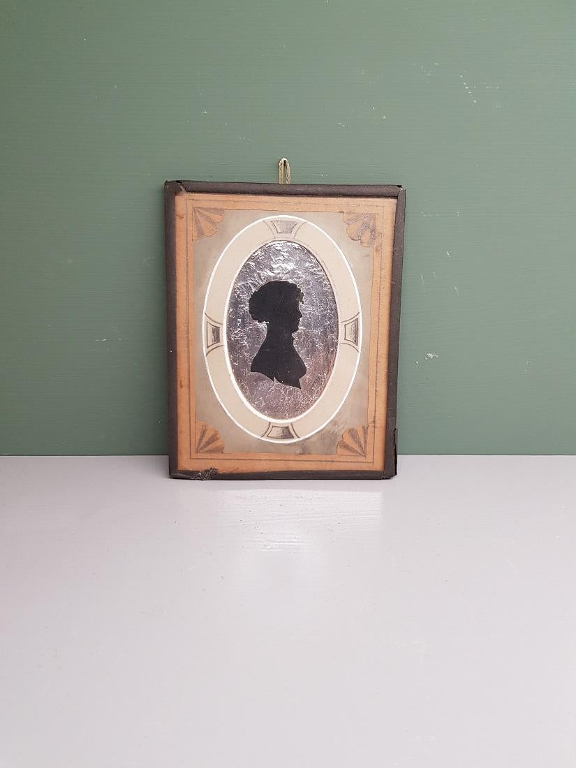 European Early 19th Century Miniature Silhouette of a Lady on a Silver Paper Background For Sale