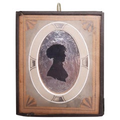 Antique Early 19th Century Miniature Silhouette of a Lady on a Silver Paper Background
