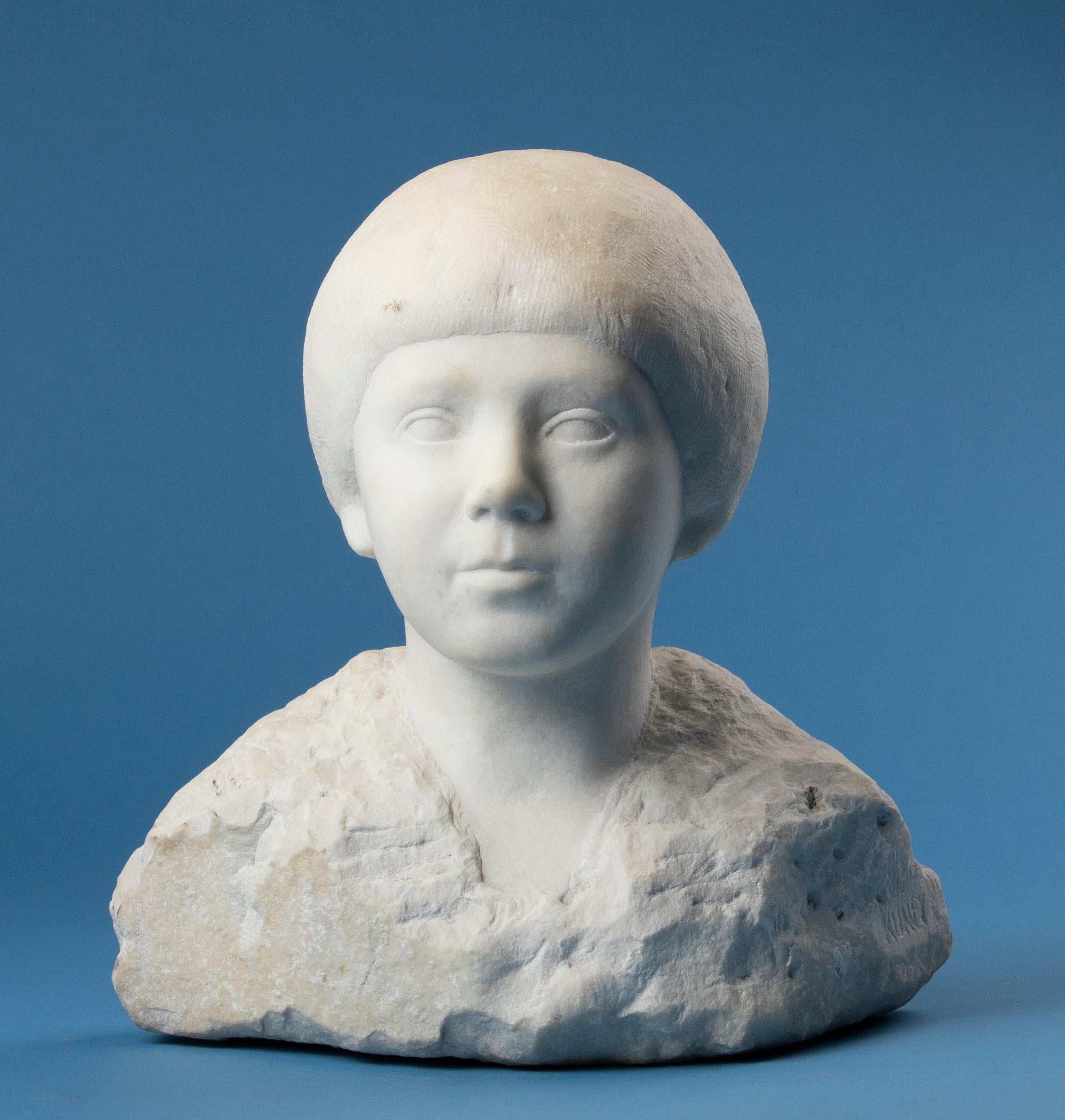 Beautiful marble bust of a young child.
This statue is hand cut from Carrara marble.
This statue dates from circa 1930, from the modernist Art Deco period. The beautiful, smooth face of the child contrasts nicely with the rough, unfinished