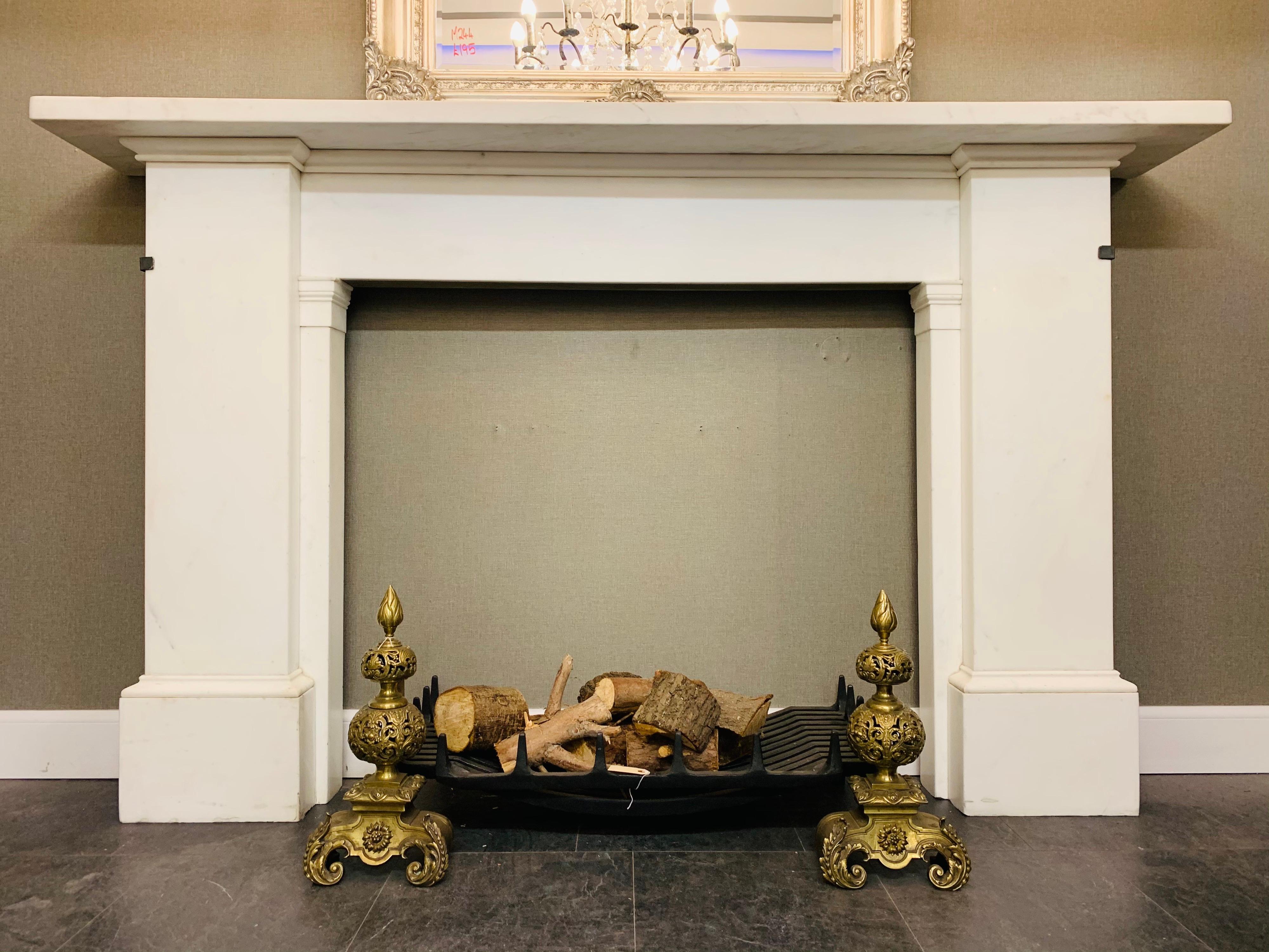 An early 1830 19th century Georgian monumental Scottish statuary marble fireplace surround of great importance. A very large and generous shelf sits above an anadorened frieze, flanked by large and tall jambs with wrap around corvetto moulding to