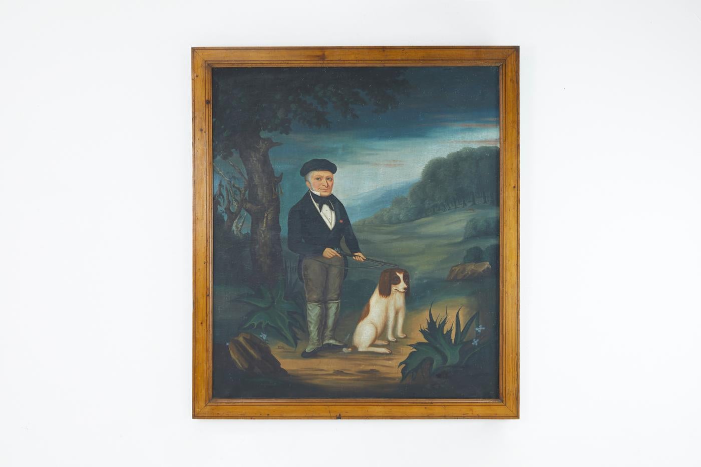 An early 19th century French naive oil on canvas painting of a man and his dog.