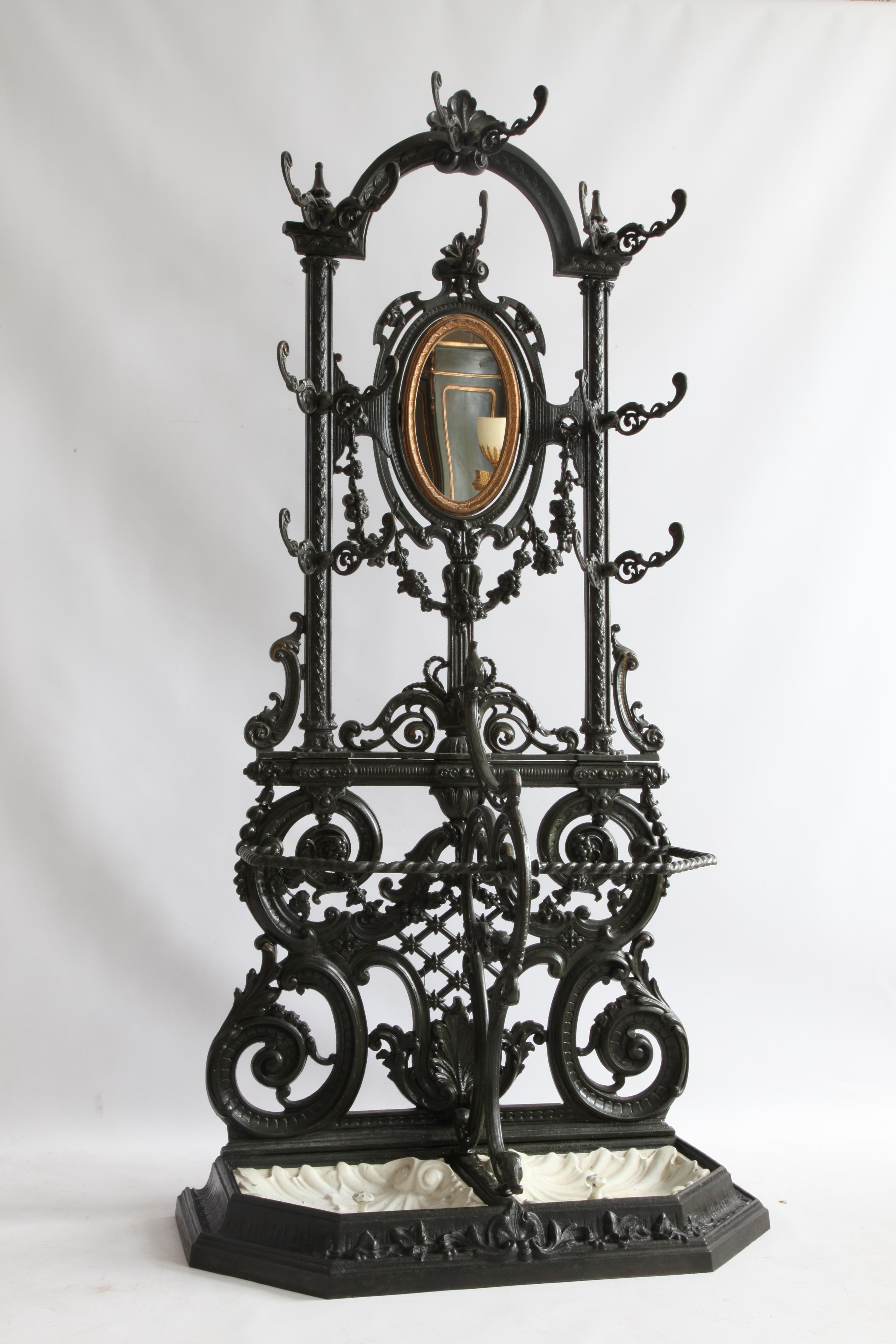 An impressive 19th century, Napoleon III, cast iron coat, hat and umbrella stand from the Frères Corneau, brothers Alfred and Èmile, who were master ironsmiths who started one of the leading Iron foundries in Europe from Ardenne, France in 1846. The