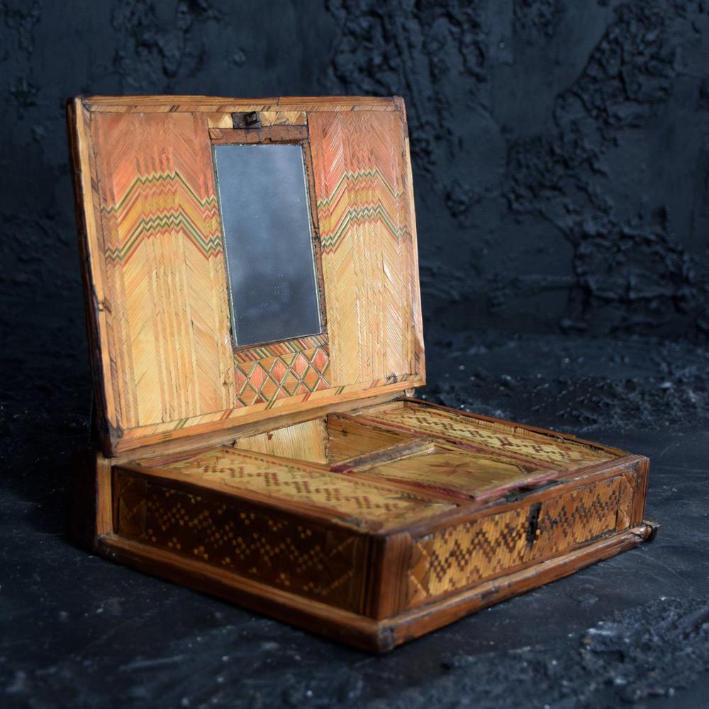 Early 19th century Napoleonic prisoner of war straw box
We are proud to offer an early 19th century Napoleonic prisoner of war straw work marquetry ladies sewing or jewellery box. With hinged lid opening to reveal a mirror in the lid and 3