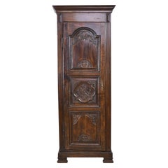 Early 19th Century Narrow French Bonnetiere or Cupboard with Carved Birds