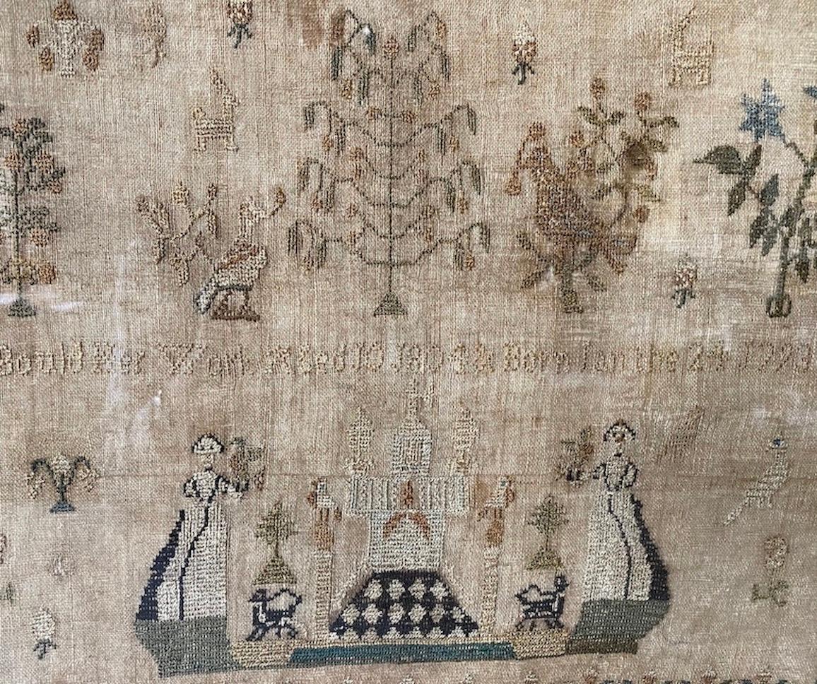 A young girl's hand-done sampler, of silk thread on linen ground. It is decorated in floral, meandering borders surrounding an open background, with various floating bird and animal figures amongst trees and flowering plants. Placed at the