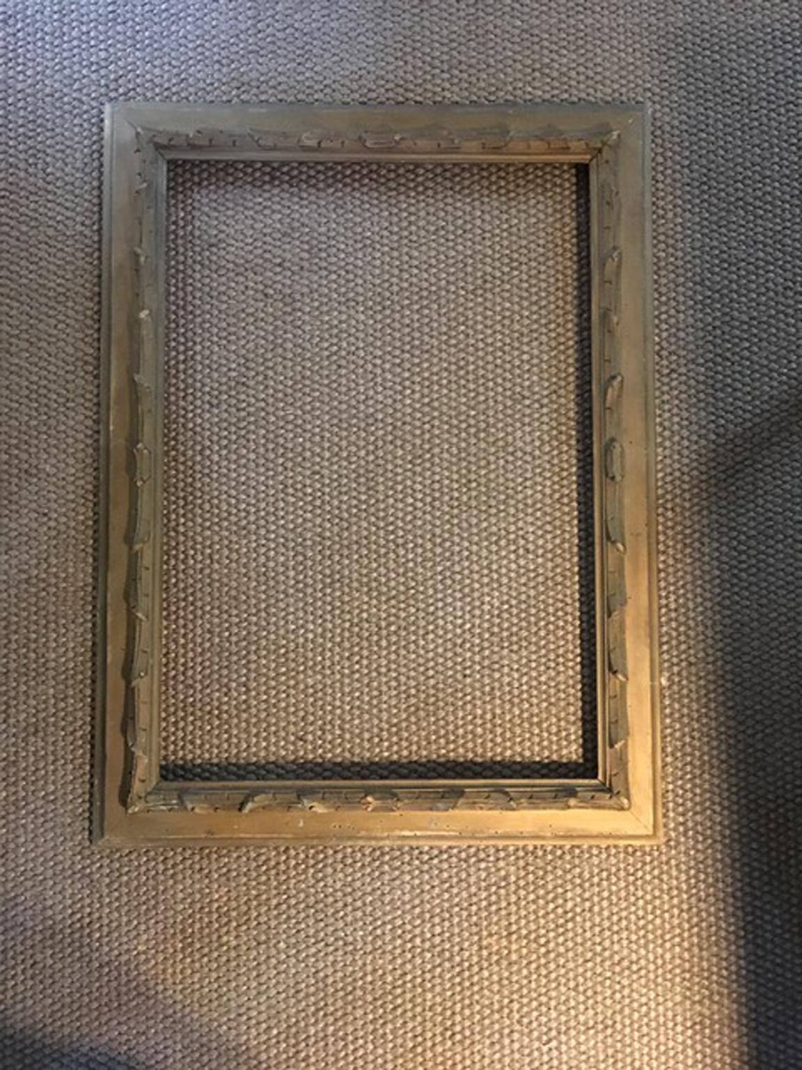 This is an elegant wood frame, lacquered in mat gold. The thick hand carved border also is lacquered in gold.
The frame has the look of the past and shows all the signs of the age, but remains a piece of great charm.

Never restored.
With