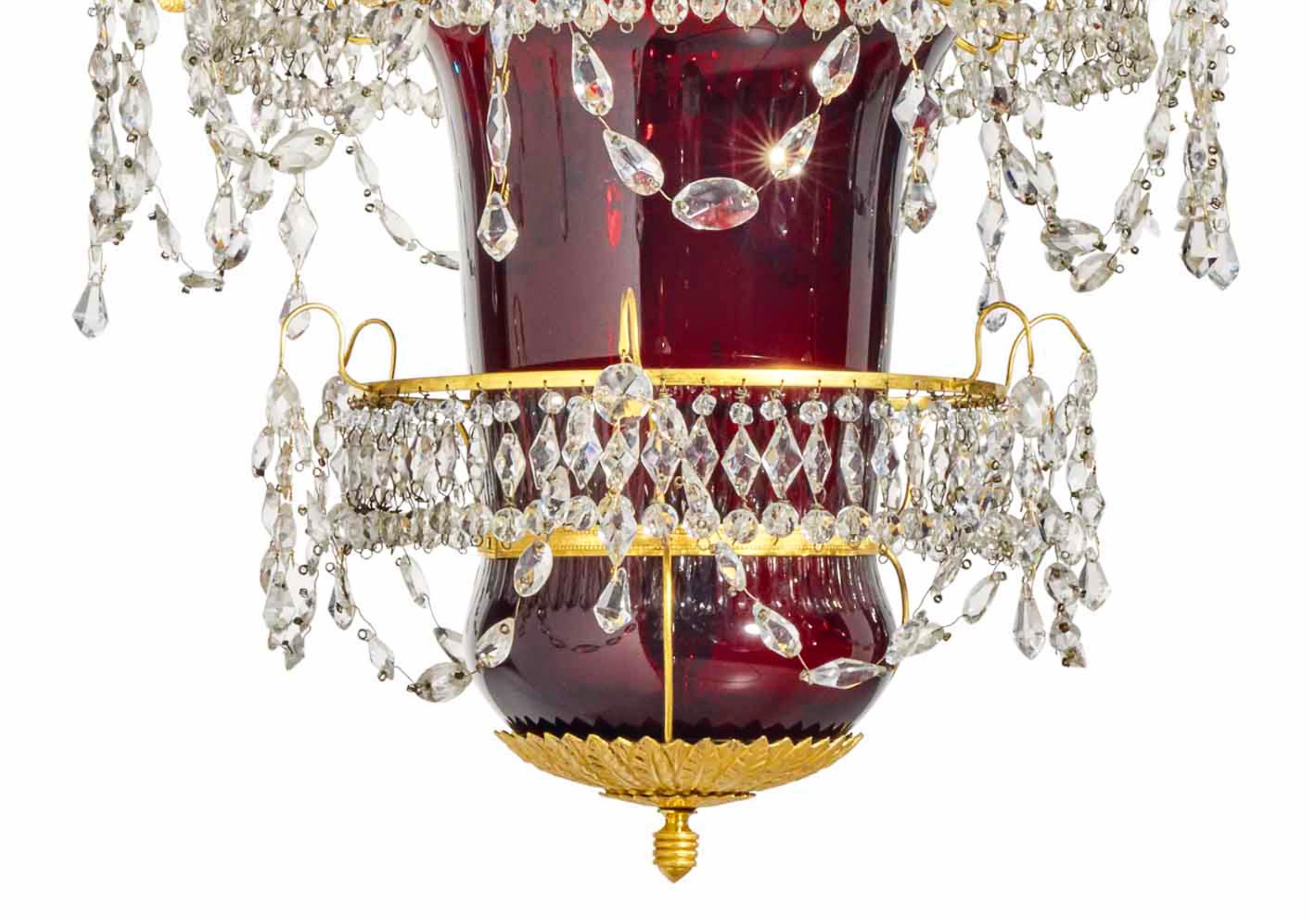 Early 19th century Russian ruby glass and ormolu chandelier or lantern. Original gilded bronze structure with original handcut crystal prisms. Swan necks holding candle cups

Provenance: Christies Paris to private collector.